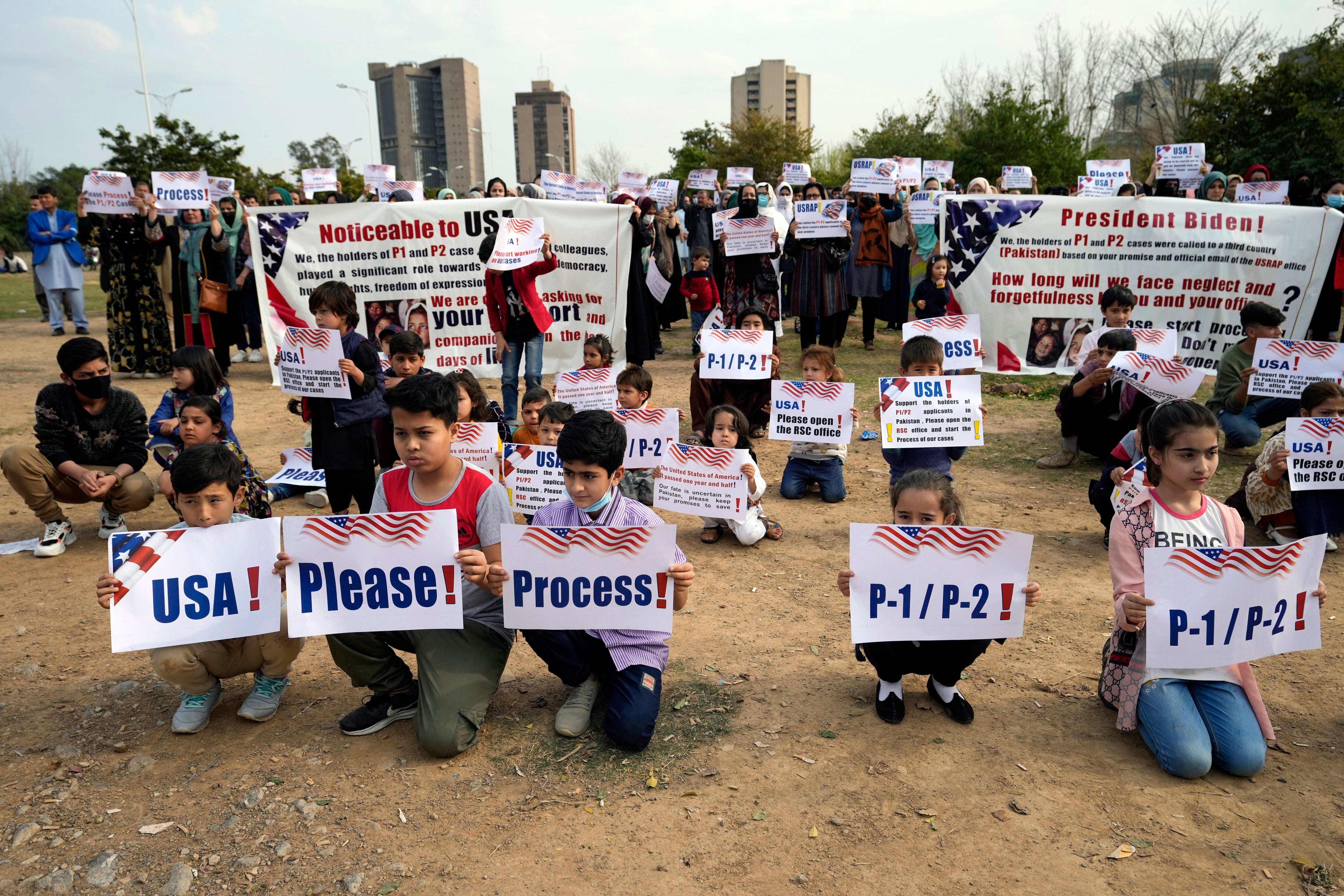 Afghan refugees hold a rally to demand their U.S. visas to be processed in Islamabad, Pakistan, Sunday, Feb. 26, 2023.