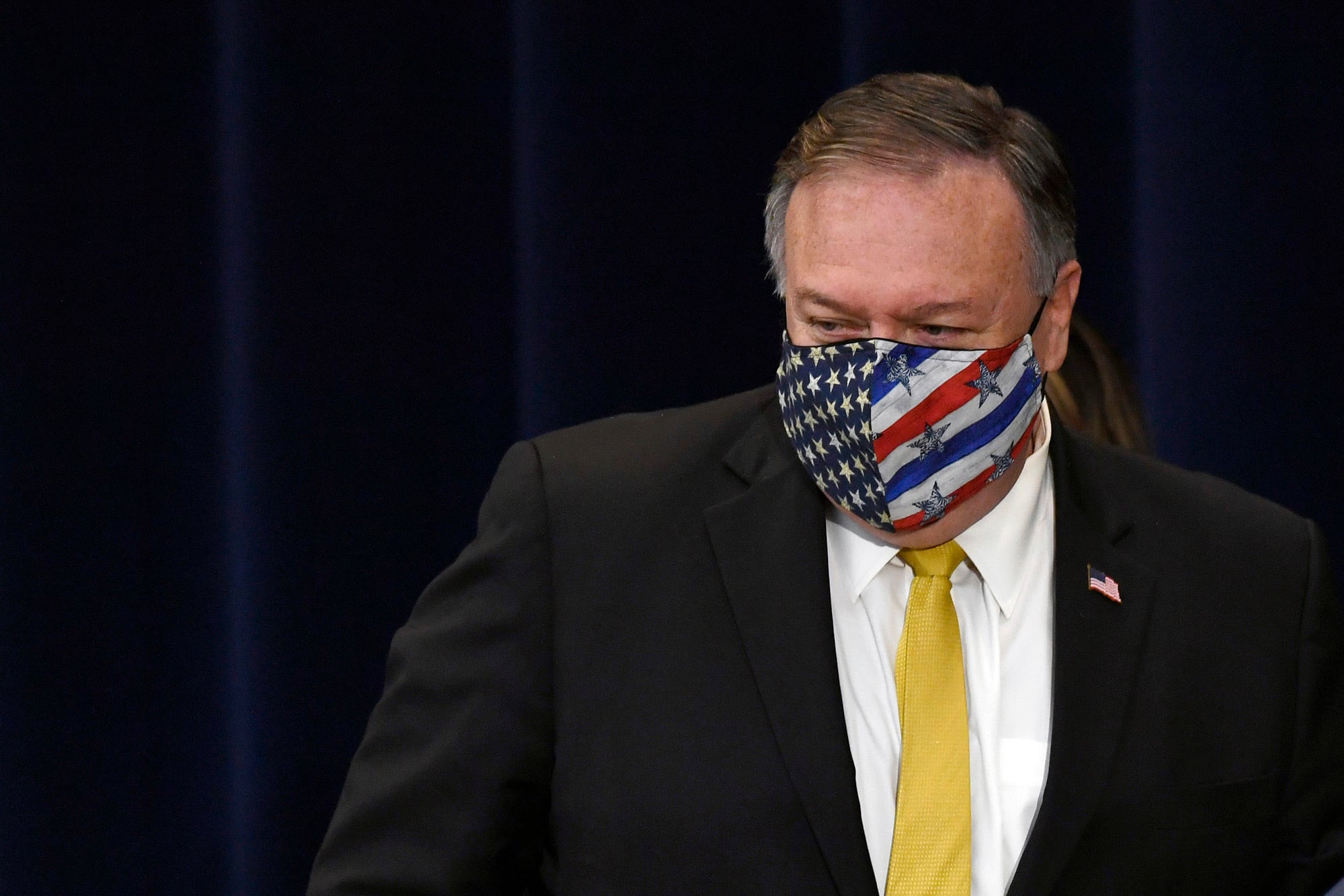 Secretary of State Mike Pompeo walks off of the stage following a news conference at the State Department in Washington, Wednesday, Aug. 19, 2020, with Iraqi Foreign Minister Fuad Hussein.