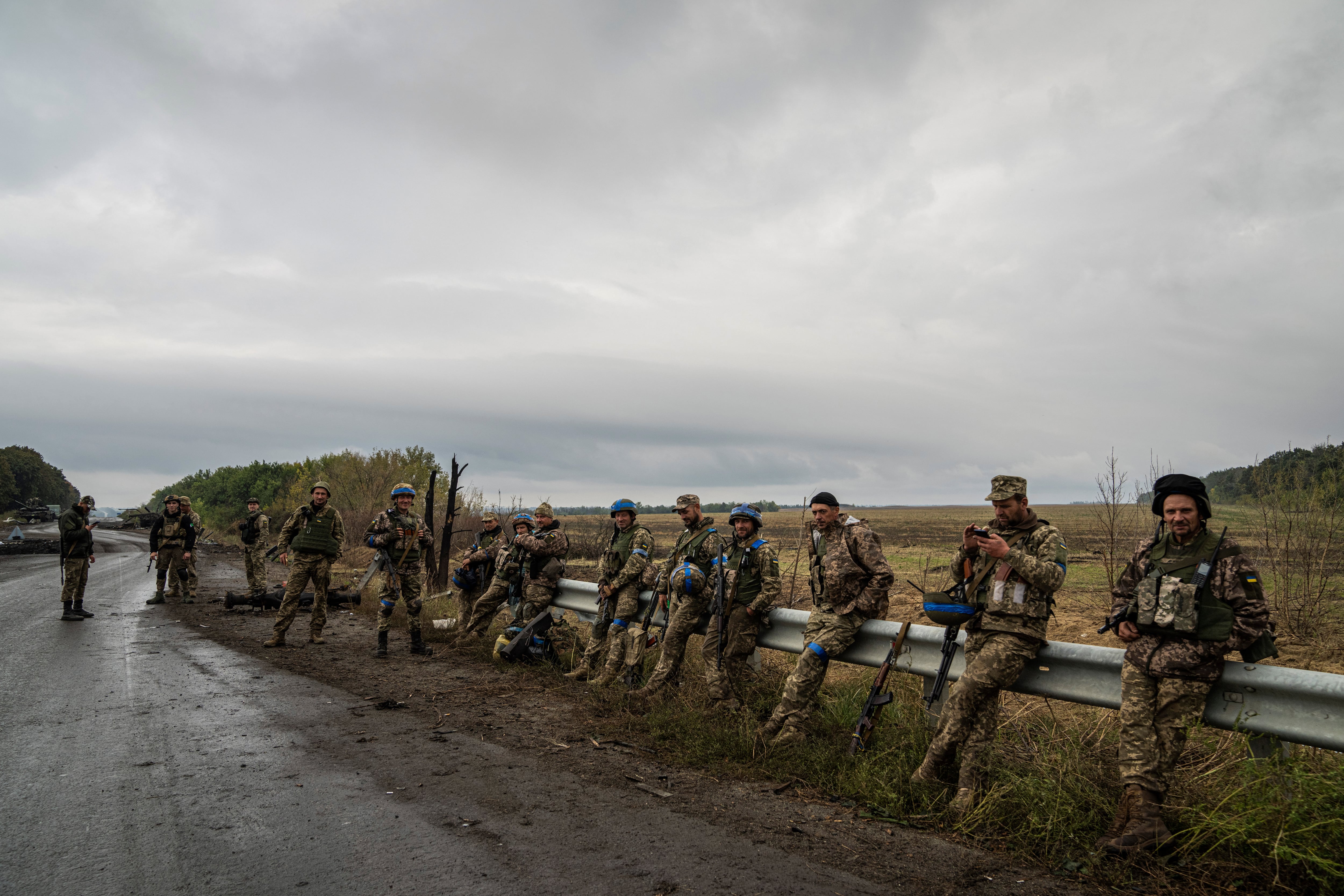 Ukrainian servicemen rest at a former Russian position in the recently retaken area of Izium, Ukraine, Friday, Sept. 16, 2022.