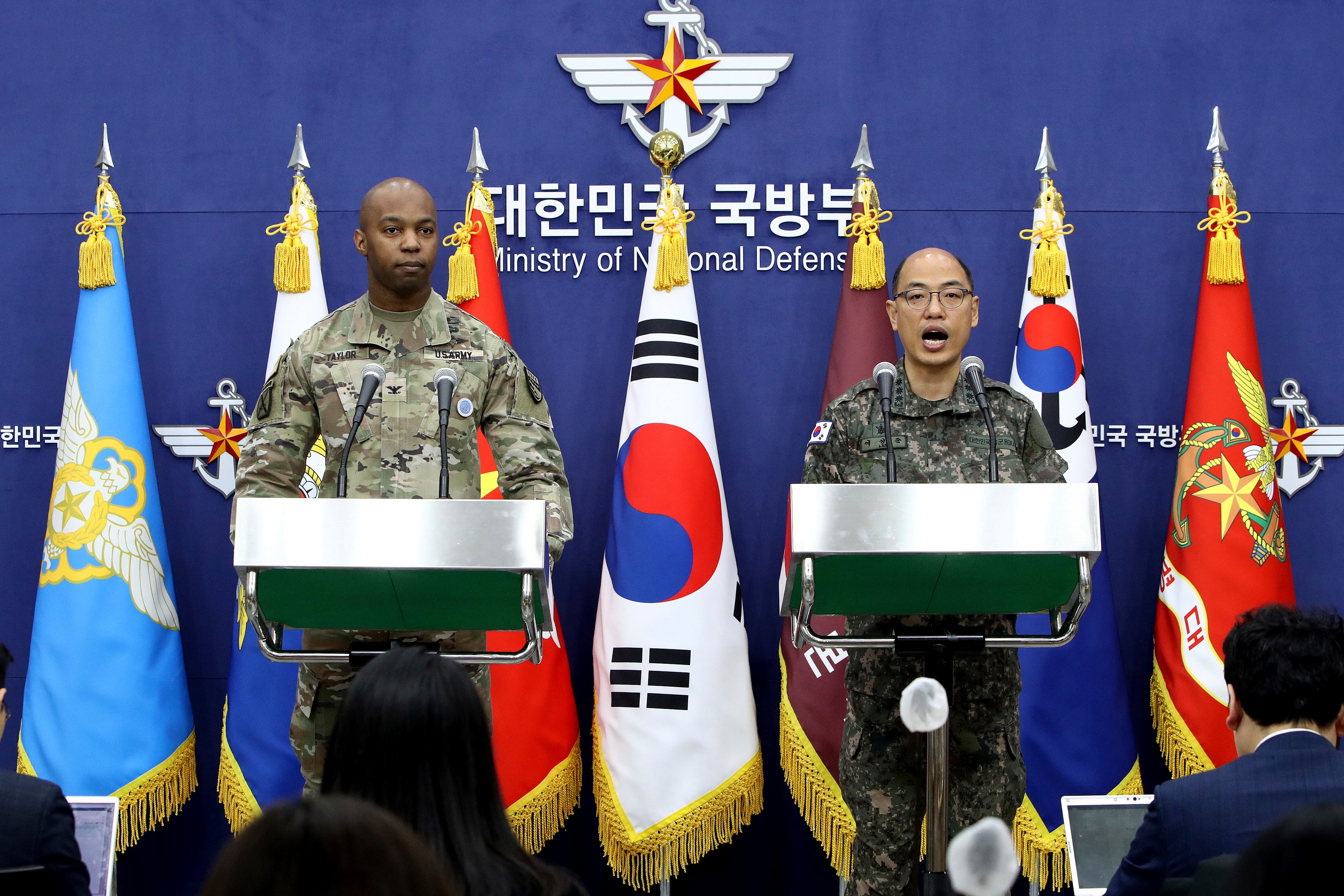 Col. Isaac Taylor, left, of the United Nations Command (UNC), Combined Forces Command (CFC), and United States Forces Korea (USFK) and Col. Lee Sung-jun of South Korea's Joint Chiefs of Staff attend the press briefing of the Freedom Shield Exercise at the Defense Ministry Friday, March 3, 2023 in Seoul, South Korea.