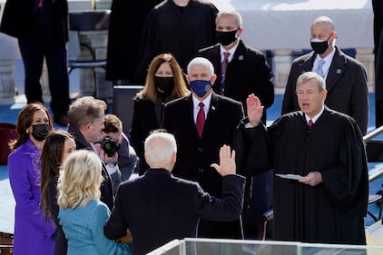 Joe Biden is sworn in as the 46th president of the United States by Chief Justice John Roberts as Jill Biden holds the Bible during the 59th Presidential Inauguration at the U.S. Capitol in Washington, Wednesday, Jan. 20, 2021.