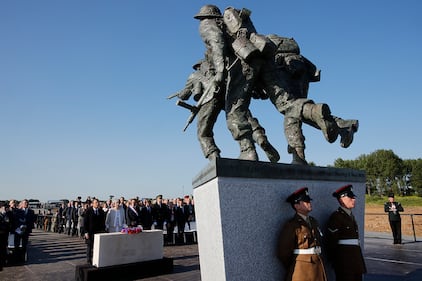 British Prime Minister Theresa May and French President Emmanuel Macron attend a Franco-British ceremony marking the 75th anniversary of D-Day landings at Ver-Sur-Mer, Normandy