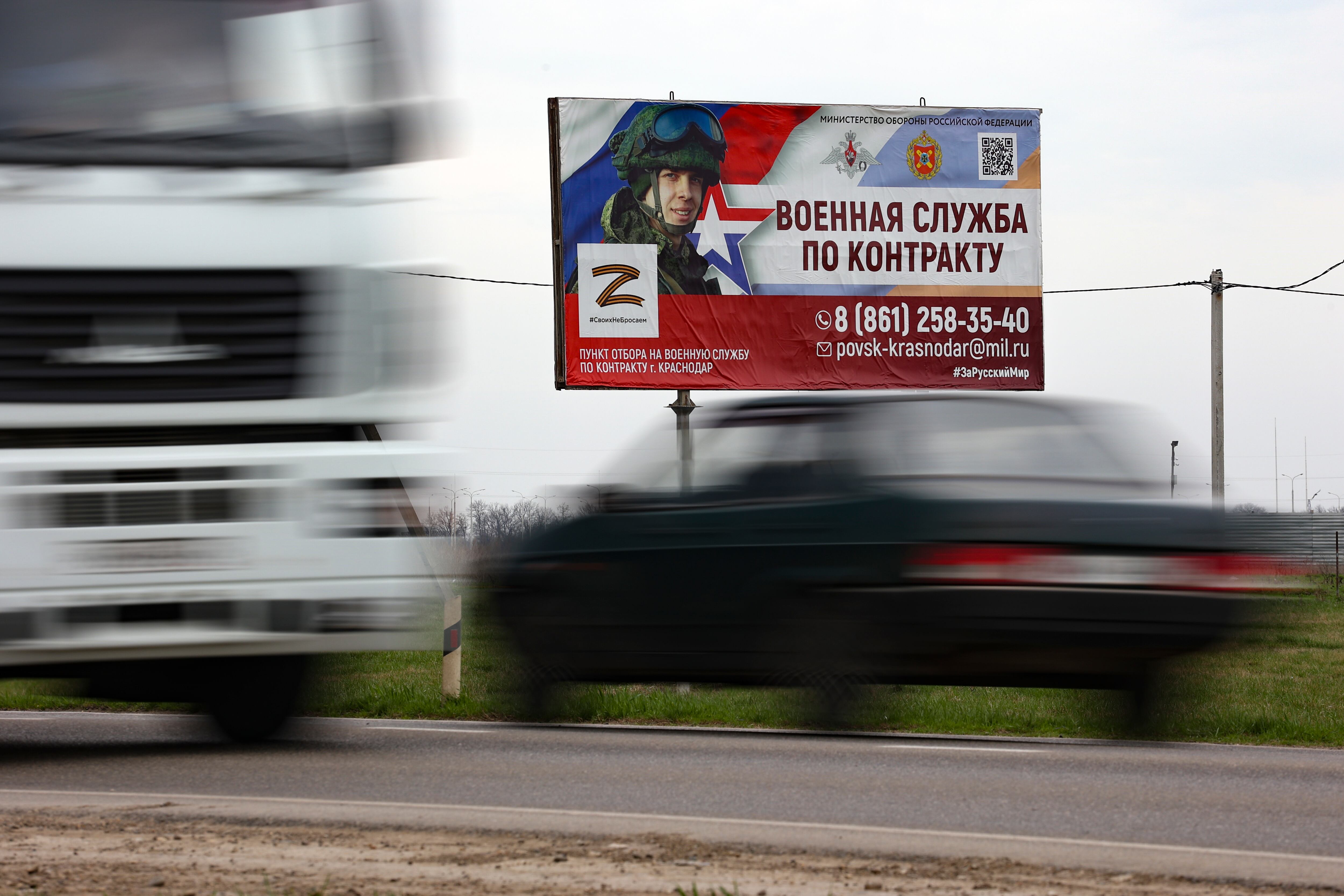 A billboard advertising "Contract military service" is seen beside a highway outside Krasnodar, Russia, Thursday, March 23, 2023.