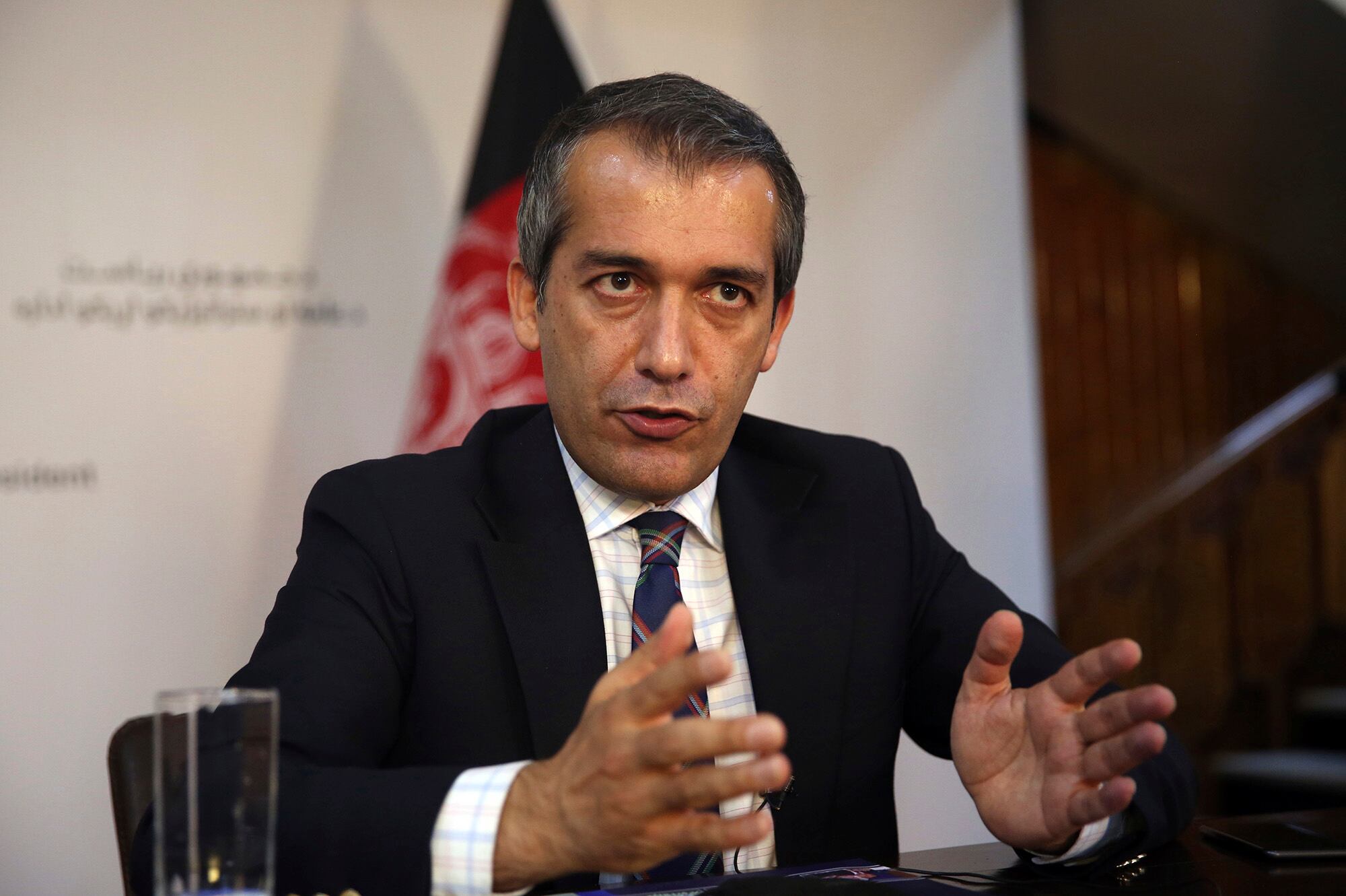 Afghan presidential spokesman Sediq Seddiqi gives an interview to The Associated Press in Kabul, Afghanistan, Monday, Aug. 17, 2020.