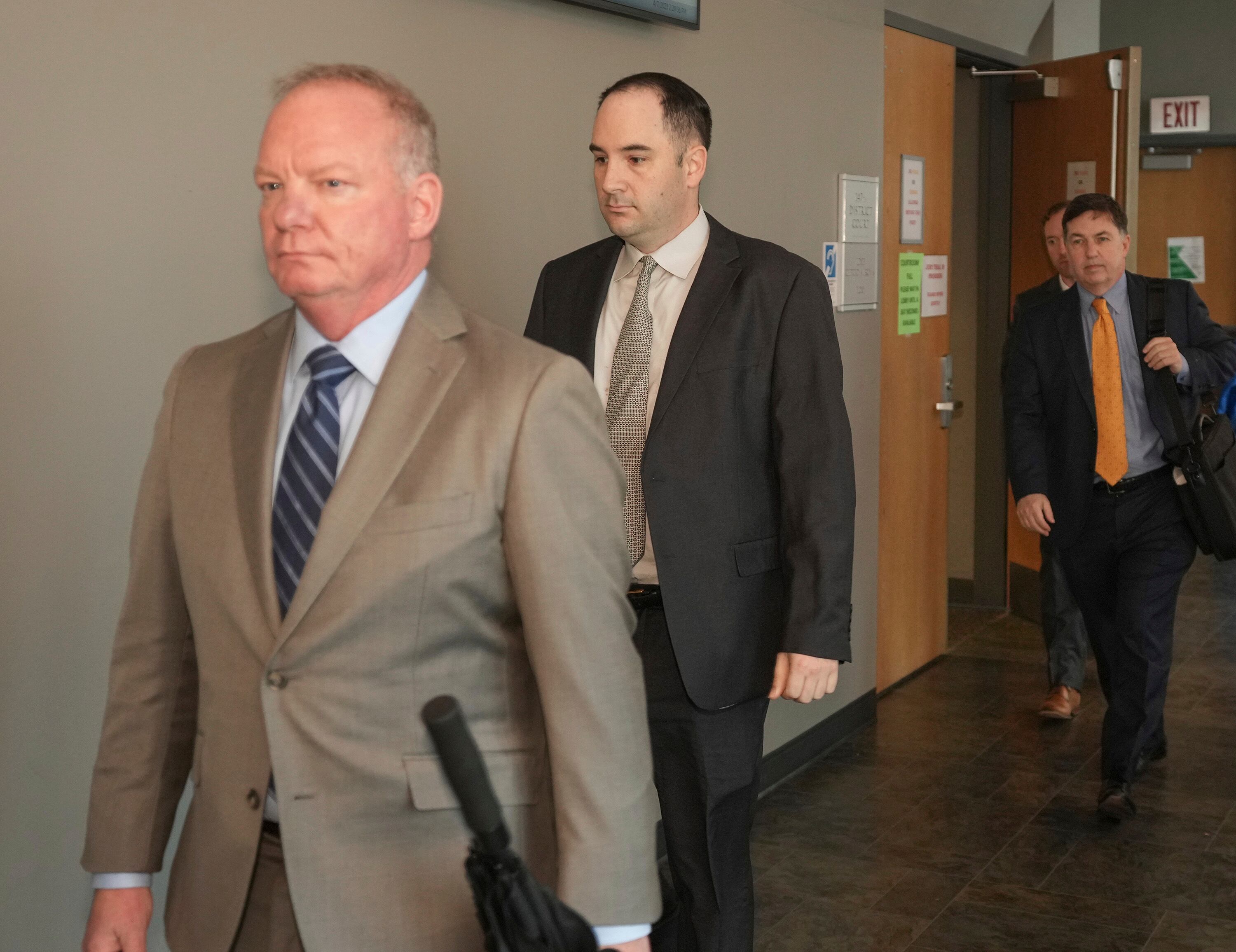 Army Sgt. Daniel Perry, center, and his attorney Doug O'Connell, left, walk out of the courtroom during jury deliberations in his murder trial, Friday, April 7, 2023, at the Blackwell-Thurman Criminal Justice Center in Austin, Texas.