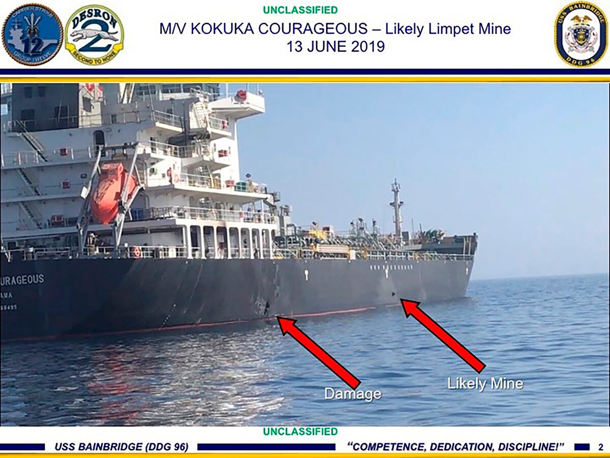 This June 13, 2019, image released by the U.S. military's Central Command, shows damage and a suspected mine on the Kokuka Courageous in the Gulf of Oman near the coast of Iran.