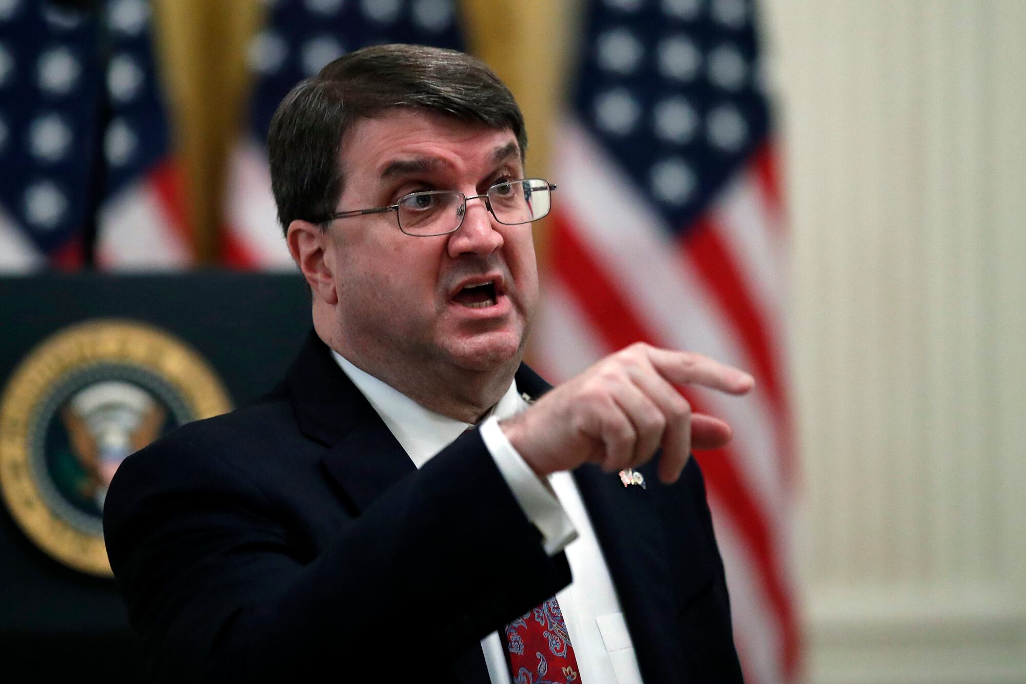 Veterans Affairs Secretary Robert Wilkie talks before President Donald Trump arrives to speak about protecting seniors, in the East Room of the White House, Thursday, April 30, 2020, in Washington.