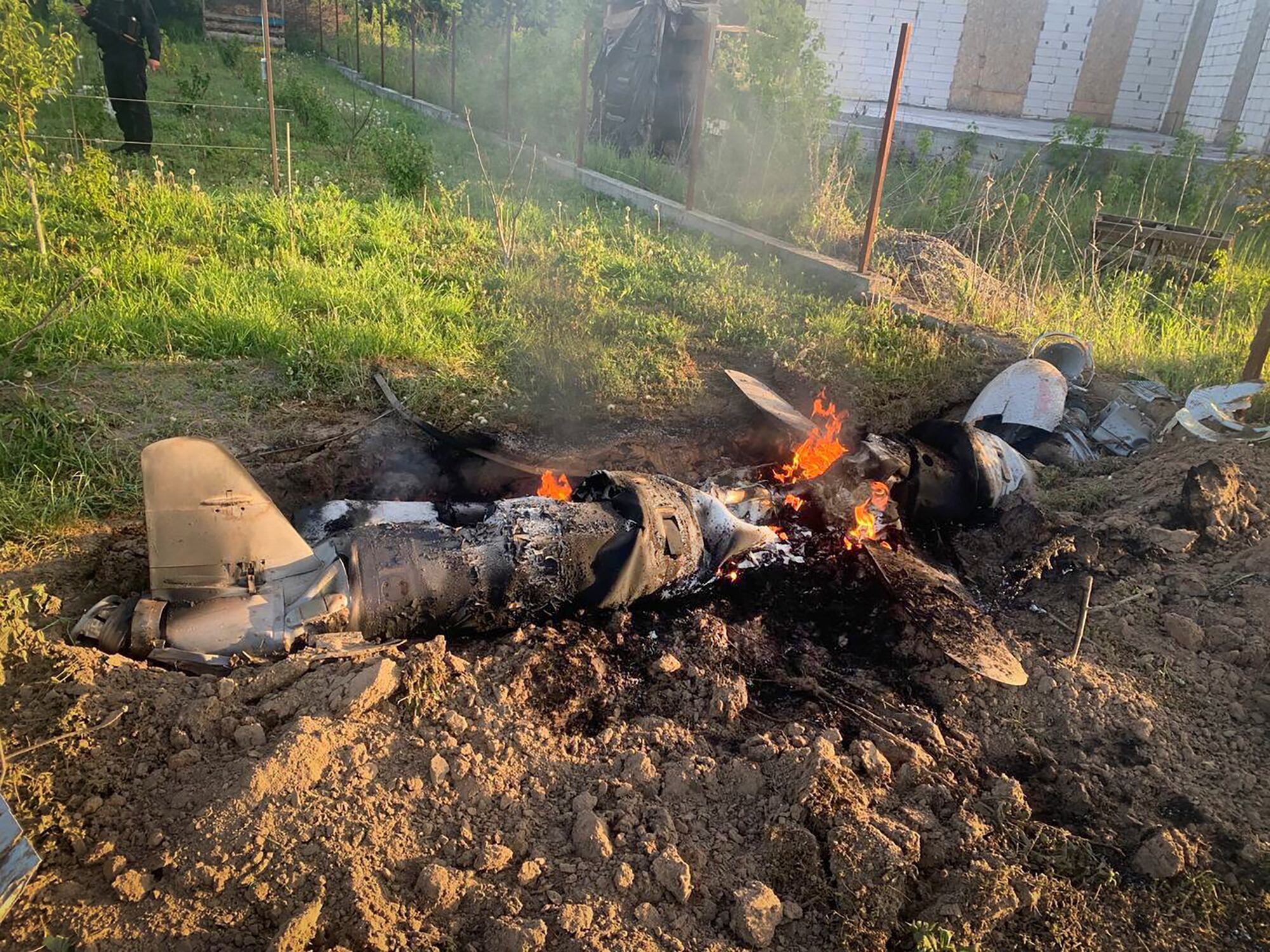 In this photo provided by the Ukrainian Police Press Office, fragments of a Russian rocket which was shot down by Ukraine's air defence system are seen after the night rocket attack in the Kyiv region, Ukraine, Thursday, May 18, 2023.