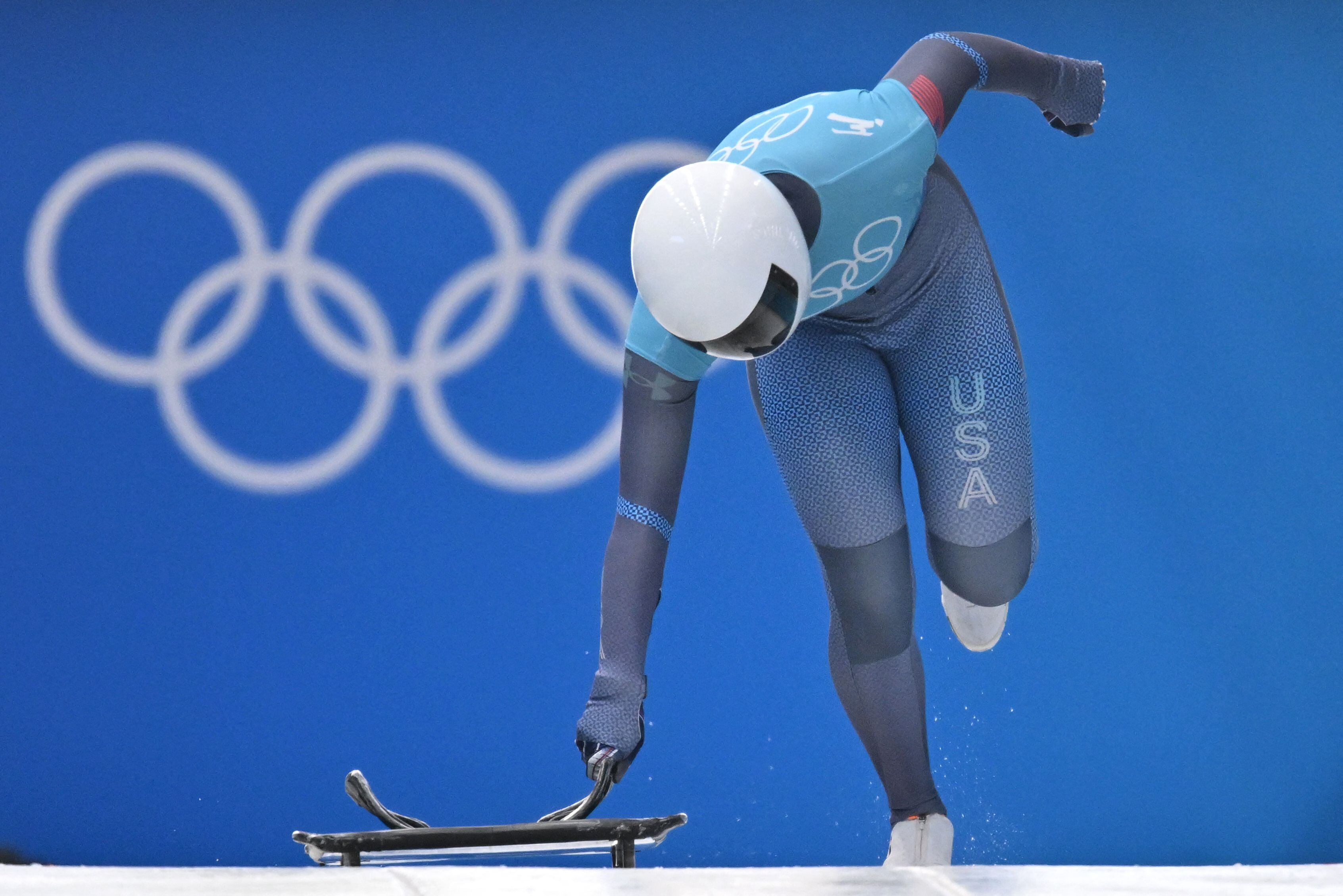 USA's Kelly Curtis takes part in the women's skeleton training at the Yanqing National Sliding Centre during the Beijing 2022 Winter Olympic Games in Yanqing on February 8, 2022. (Daniel Mihailescu/AFP)