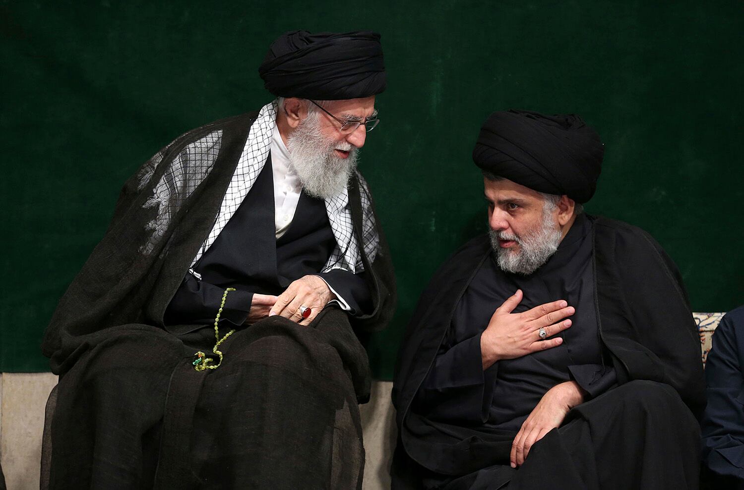 Supreme Leader Ayatollah Ali Khamenei, left, greets Iraqi Shiite cleric Muqtada al-Sadr