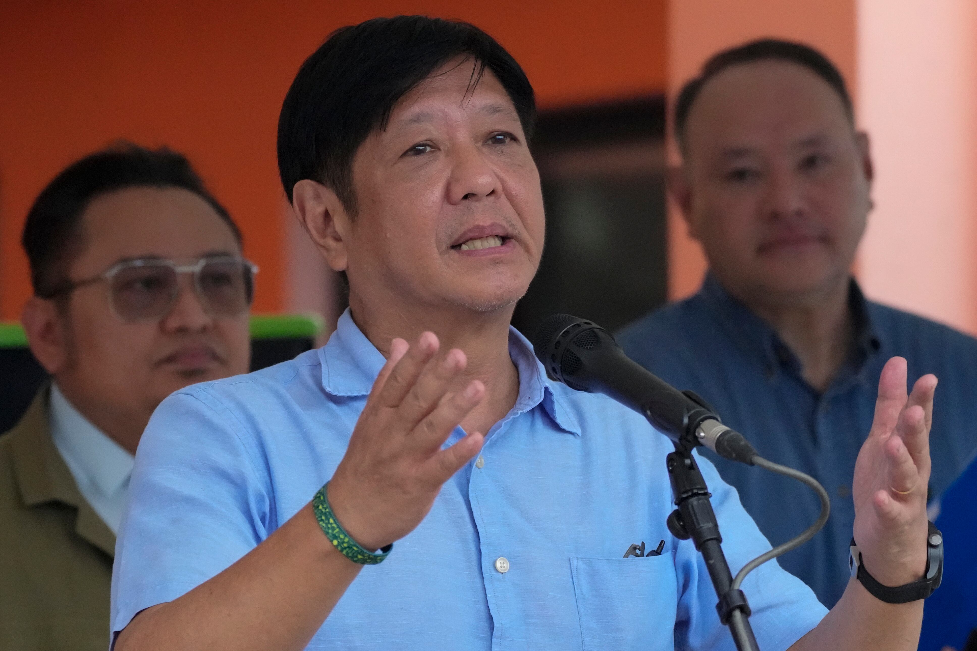 Philippine President Ferdinand Marcos Jr. gestures as he visits an evacuation center at Guinobatan, Albay province, northeastern Philippines, on June 14, 2023.