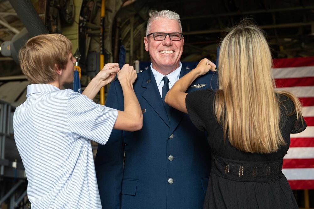 U.S. Air Force Lt. Col. Jason Horn, commander, 139th Medical Group, Missouri Air National Guard, is promoted to the rank of colonel by his wife, son and daughter at Rosecrans Air National Guard Base, St. Joseph, Missouri, Sept. 11, 2021. (Airman Janae Masoner/Air National Guard)