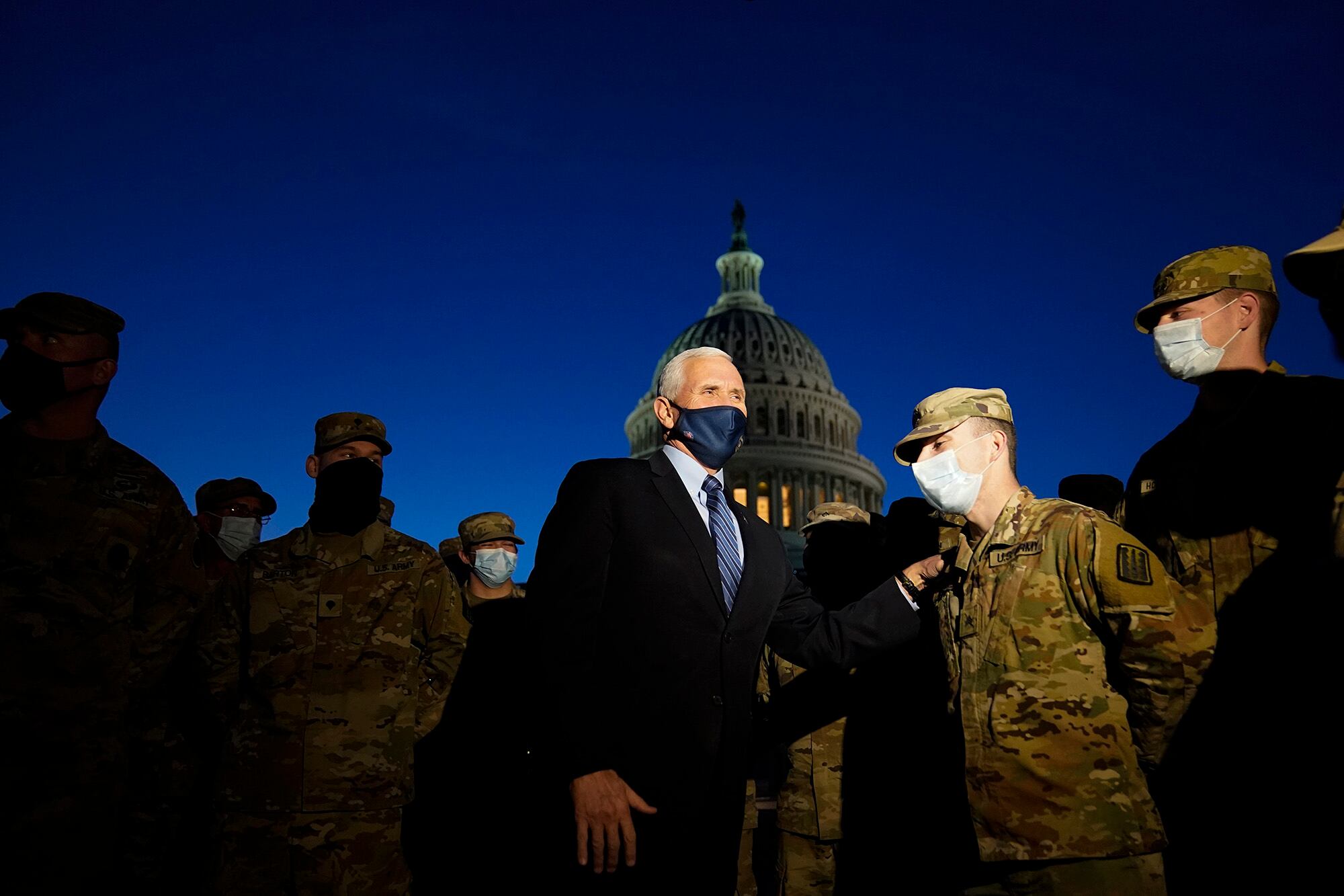 Vice President Mike Pence speaks to National Guard troops outside the U.S. Capitol, Thursday, Jan. 14, 2021, in Washington.