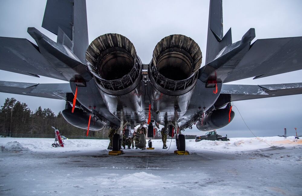 U.S. Air Force Capt. Matthew Taylor, 336th Fighter Squadron pilot from the 4th Fighter Wing located at Seymour Johnson Air Force Base, N.C., explains the capabilities of an F-15E Strike Eagle to Estonian joint terminal attack controllers during a NATO enhanced air policing mission at Ämari Air Base, Estonia, Feb. 1, 2022. (Staff Sgt. Megan M. Beatty/Air Force)