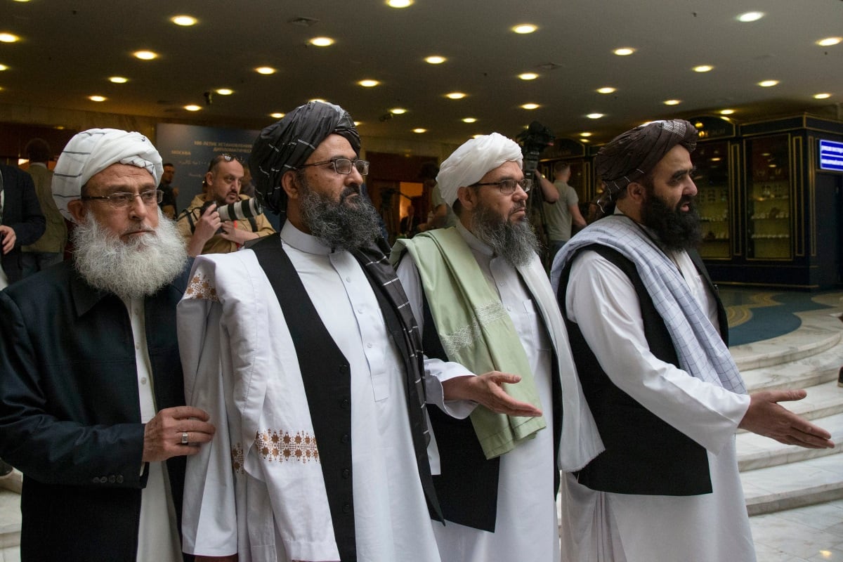 Mullah Abdul Ghani Baradar, the Taliban group's top political leader, second from left, arrives with other members of the Taliban delegation for talks in Moscow.