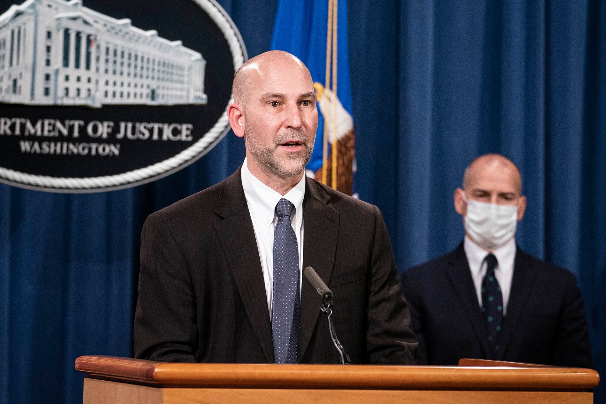 Steven D'Antuono, head of the FBI Washington field office, speaks as acting U.S. Attorney Michael Sherwin, right, listens during a news conference Tuesday, Jan. 12, 2021, in Washington.