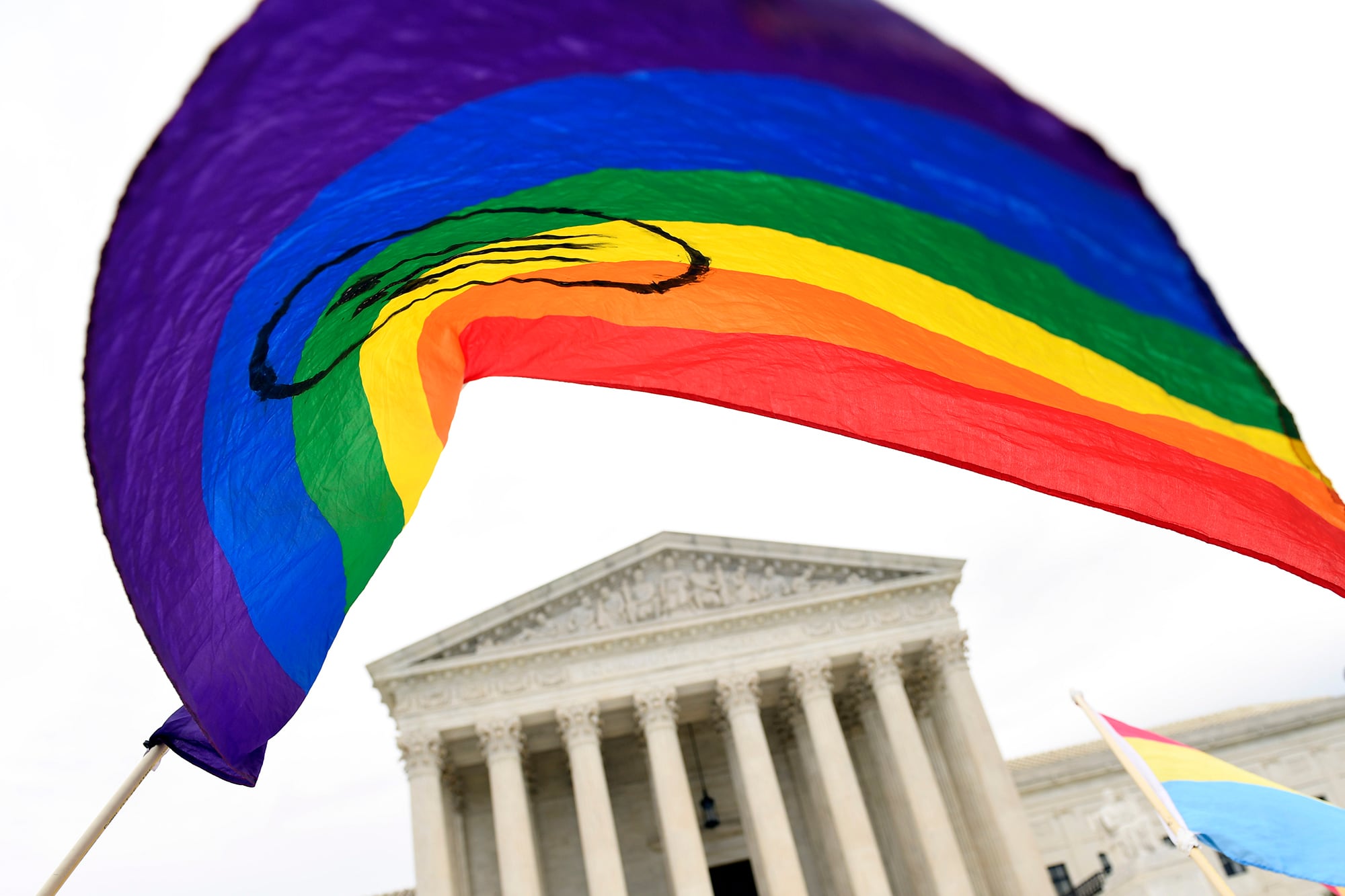 In this Oct. 8, 2019, file photo, protesters gather outside the Supreme Court in Washington.