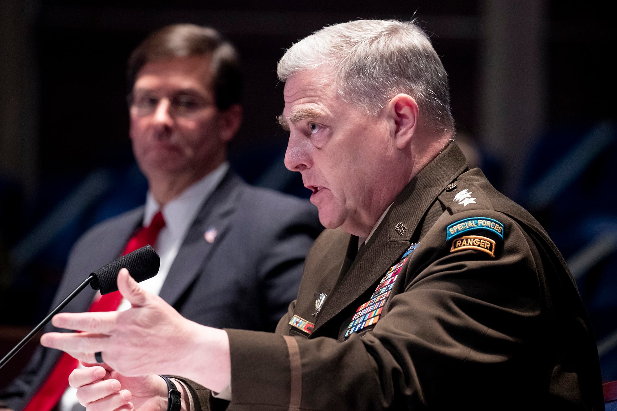 Defense Secretary Mark Esper, left, listens as Chairman of the Joint Chiefs of Staff Gen. Mark Milley testifies during a House Armed Services Committee hearing on July 9, 2020, on Capitol Hill in Washington.