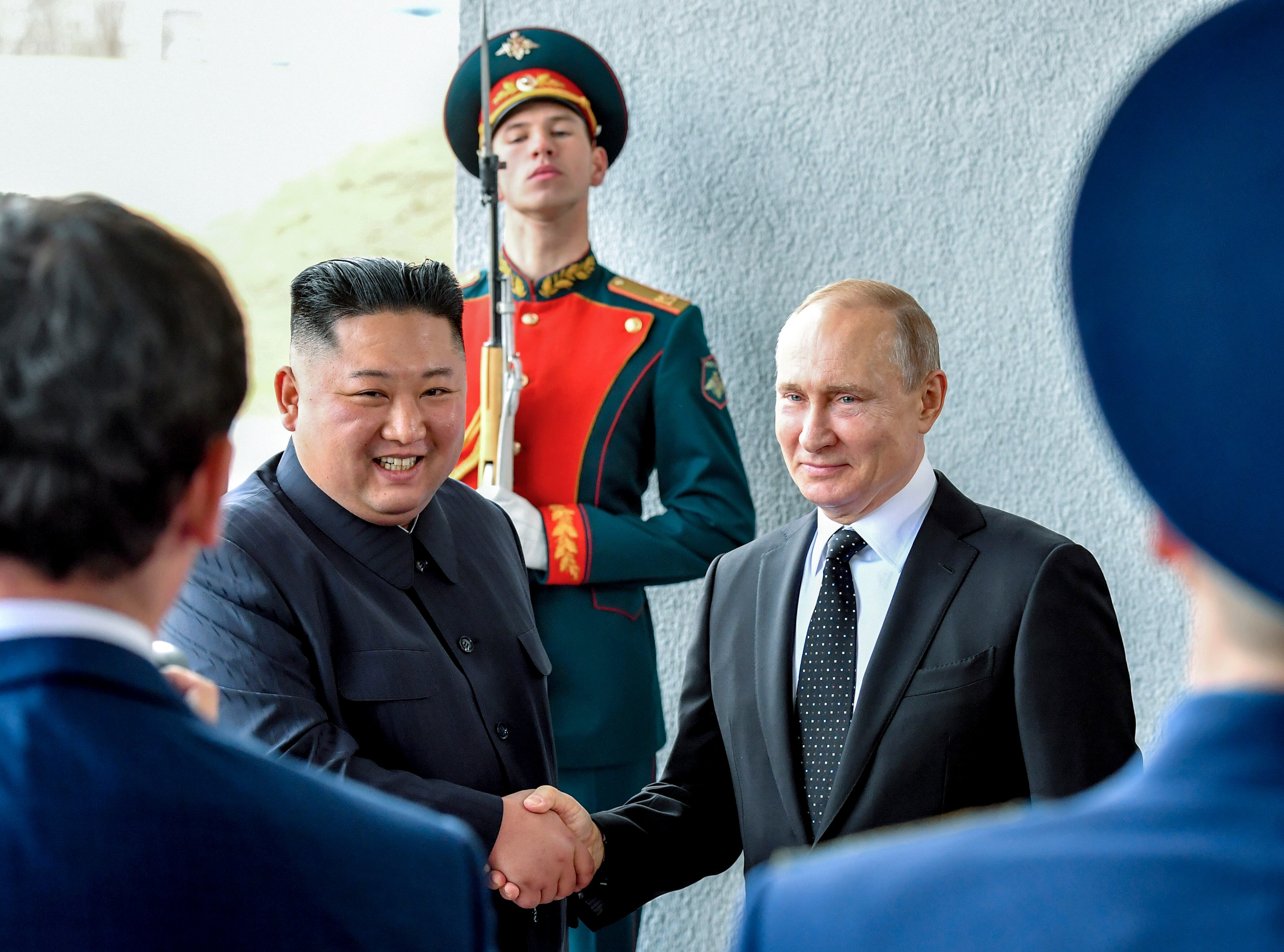 Russian President Vladimir Putin, center right, and North Korea's leader Kim Jong Un shake hands during their meeting in Vladivostok, Russia, Thursday, April 25, 2019.