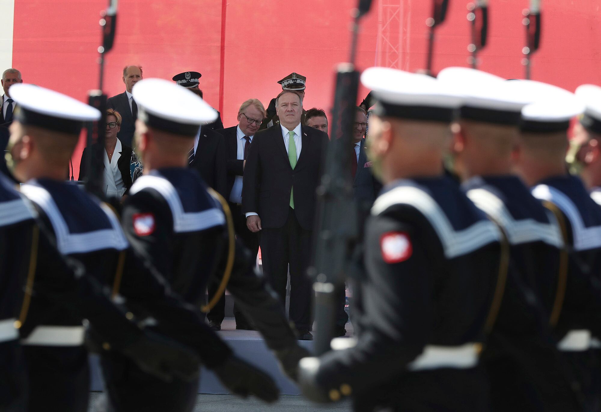 U.S. Secretary of State Mike Pompeo stands in respect for the Polish military as Poland marks the centennial of the Battle of Warsaw, a Polish military victory in 2020 that stopped the Russian Bolshevik march toward the west, in Warsaw, Poland, Saturday Aug. 15, 2020.