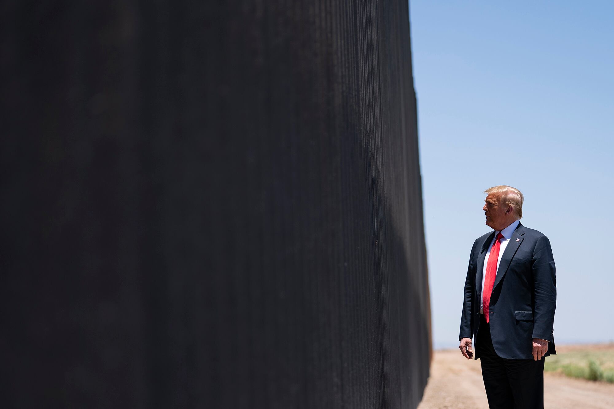 In this June 23, 2020, file photo, President Donald Trump tours a section of the border wall in San Luis, Ariz.