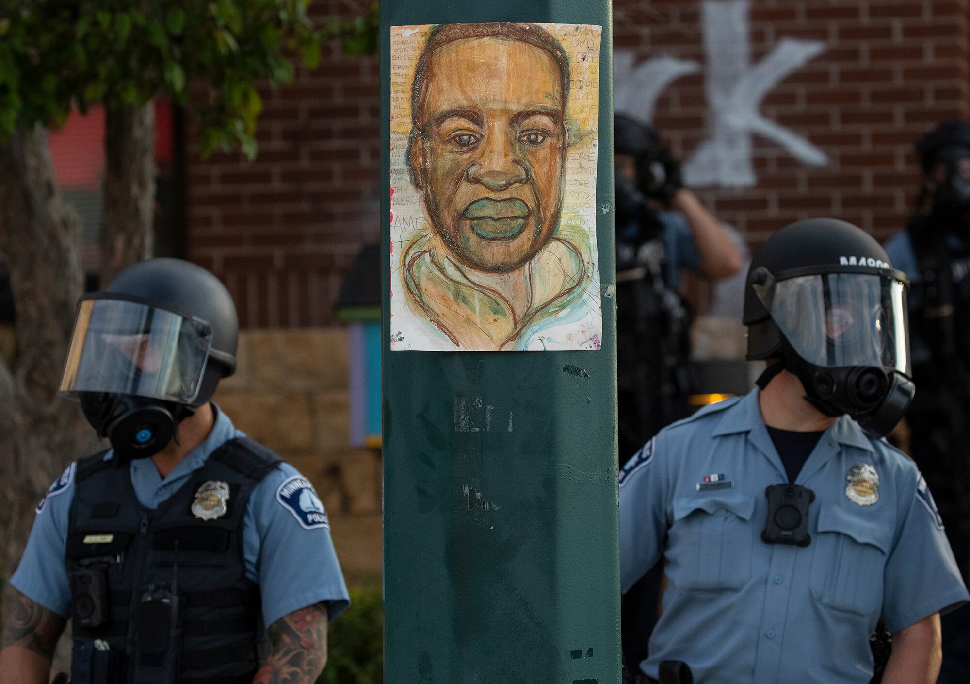 Minnesota police stand outside the department's 3rd Precinct on Wednesday, May 27, 2020, in Minneapolis.