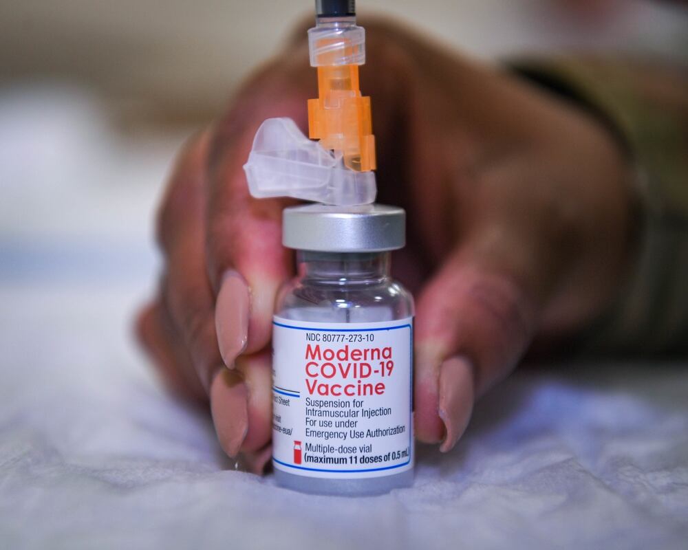 Tech. Sgt. Latasha Smith, 86th Operational Medical Readiness Squadron warrior medicine clinic flight chief, draws doses of the COVID-19 vaccine at Ramstein Air Base, Germany, Jan. 28, 2022. (Airman 1st Class Jared Lovett/Air Force)