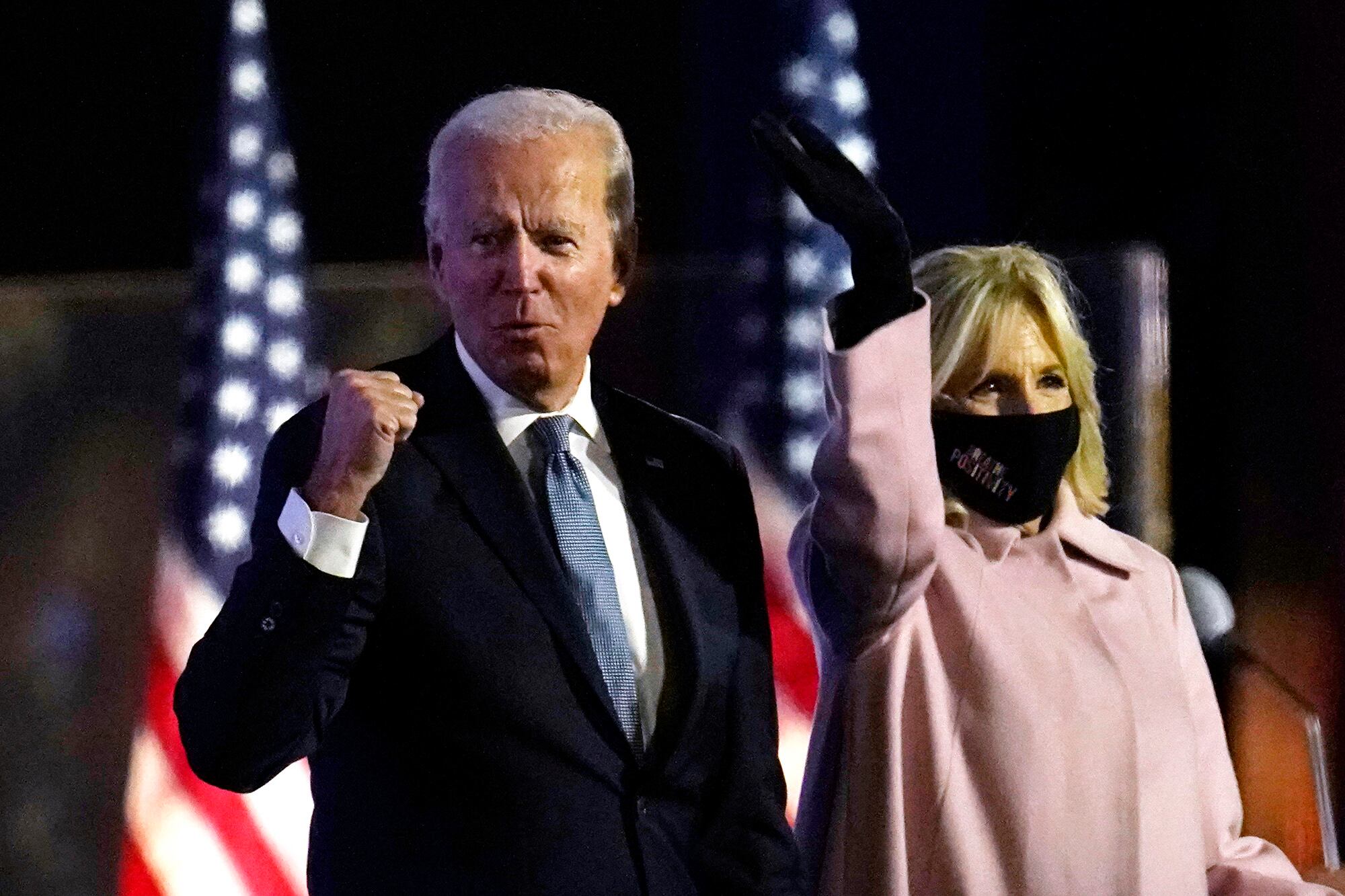 Democratic presidential candidate former Vice President Joe Biden arrives to speak to supporters, early Wednesday, Nov. 4, 2020, in Wilmington, Del., as Jill Biden looks on.