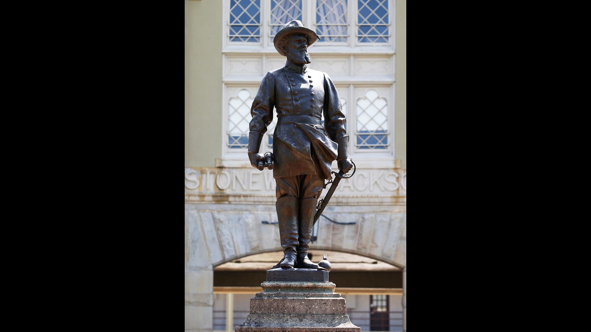 A statue of Confederate Gen. Thomas “Stonewall” Jackson stands at the entrance to the barracks at the Virginia Military Institute in Lexington, Va., in this In this July 15, 2020, file photo.