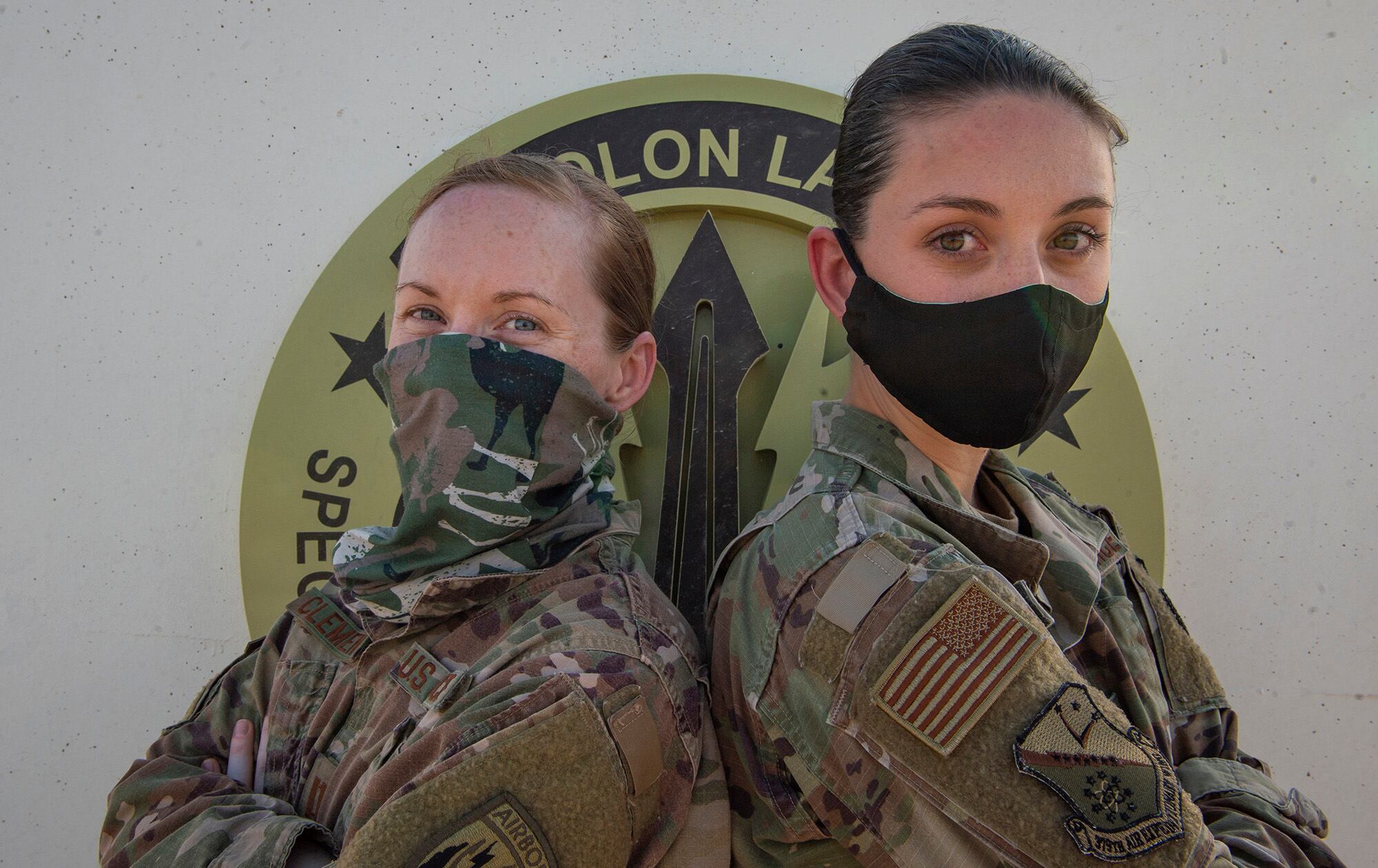 Air Force Capt. Monica Clements, and Air Force Staff Sgt. Heather Fejerang pose for a photo, June 30, 2020, at Al Udeid Air Base, Qatar.