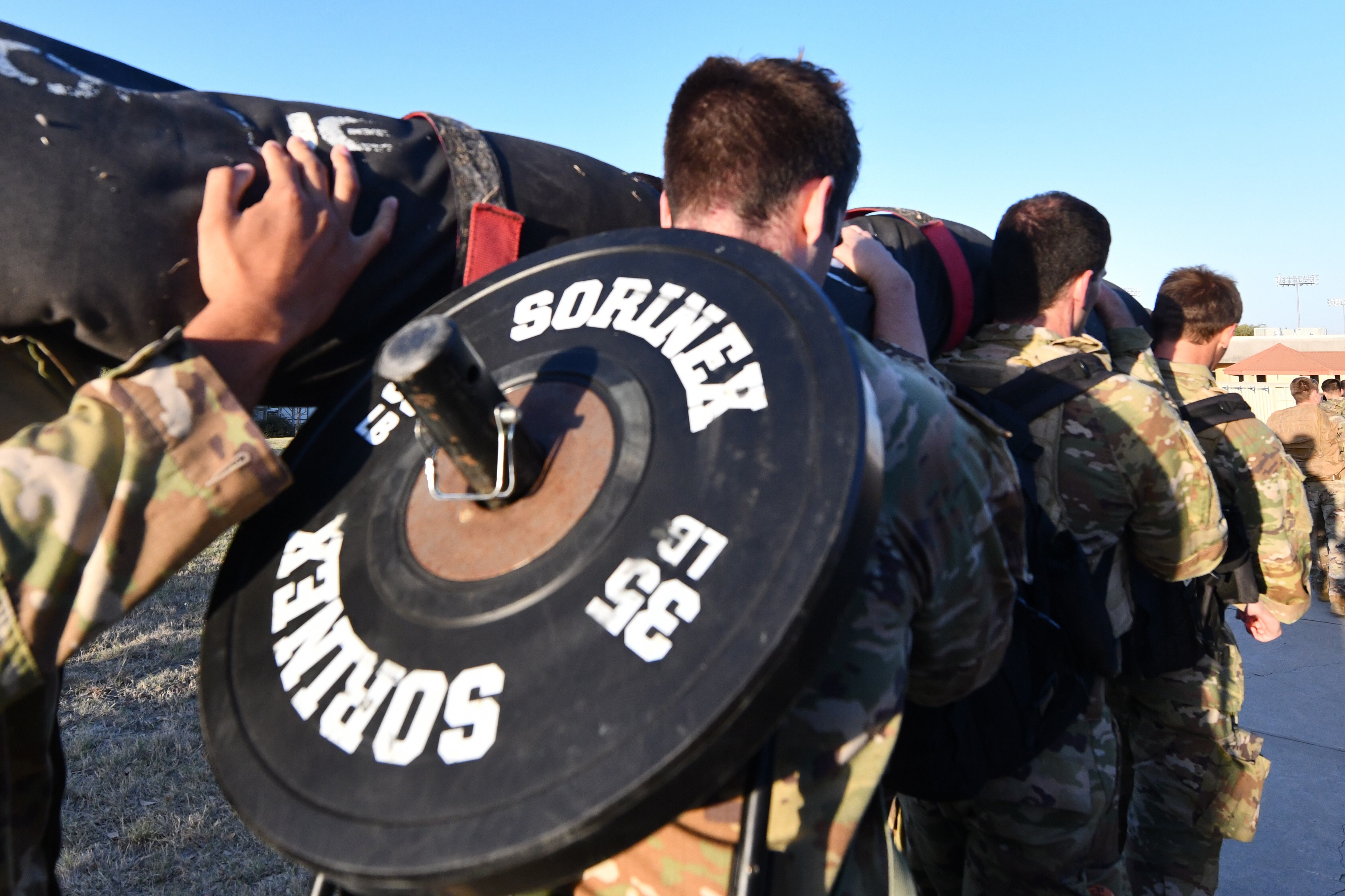 Special warfare trainees participate in the Special Warfare Training Wing rededication ceremony in honor of U.S. Air Force Lt. Col. William Schroeder and U.S. Air Force Staff Sgt. Scott Sather at the SWTW training compound Joint Base San Antonio, Chapman Training Annex, Apr. 8, 2022. (Brian Boisvert/Air Force)