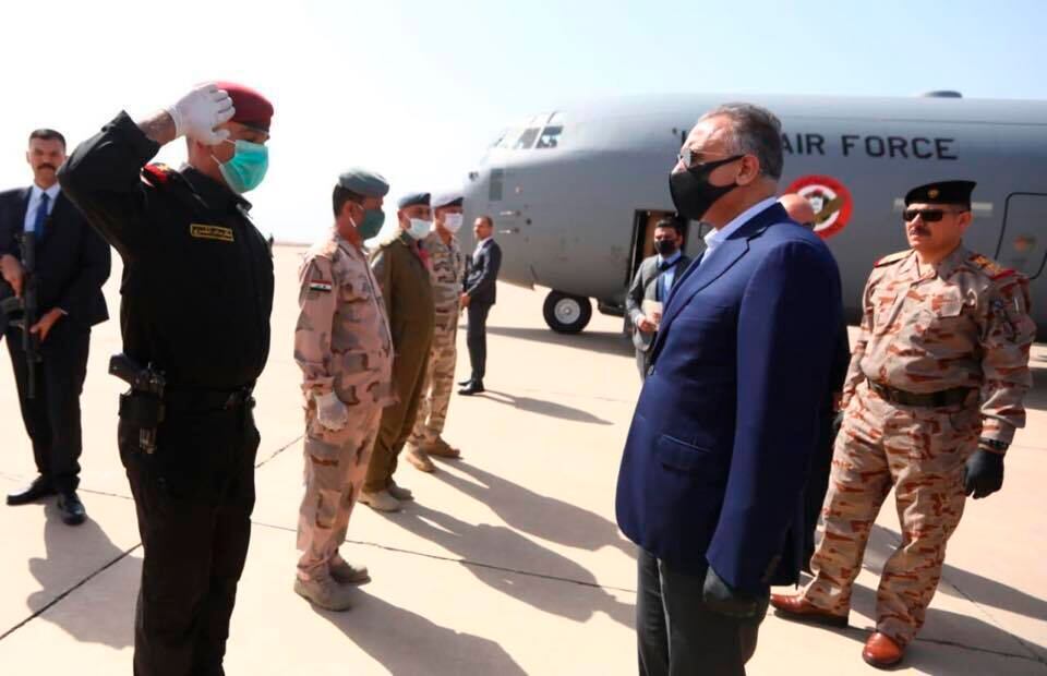 Iraqi Prime Minister Mustafa al-Kahdimi, right, arrives to Mosul, Iraq, Wednesday, June 10, 2020.