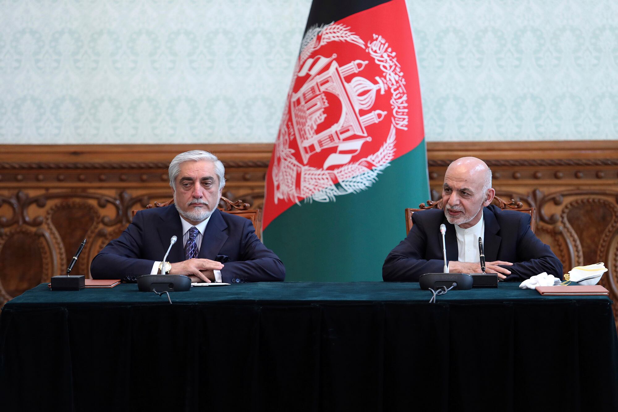 Afghan President Ashraf Ghani, right, and political rival Abdullah Abdullah, speak after they signed a power-sharing agreement at the presidential palace in Kabul, Afghanistan, Sunday, May 17, 2020.