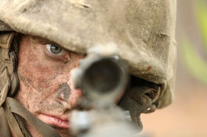 Recruit Dustin Murphy keeps watch on March 27, 2020, at Parris Island, S.C., while his fellow recruits prepare for the next events of the Crucible, a 54-hour culminating event that requires recruits to work as a unit to overcome challenges.