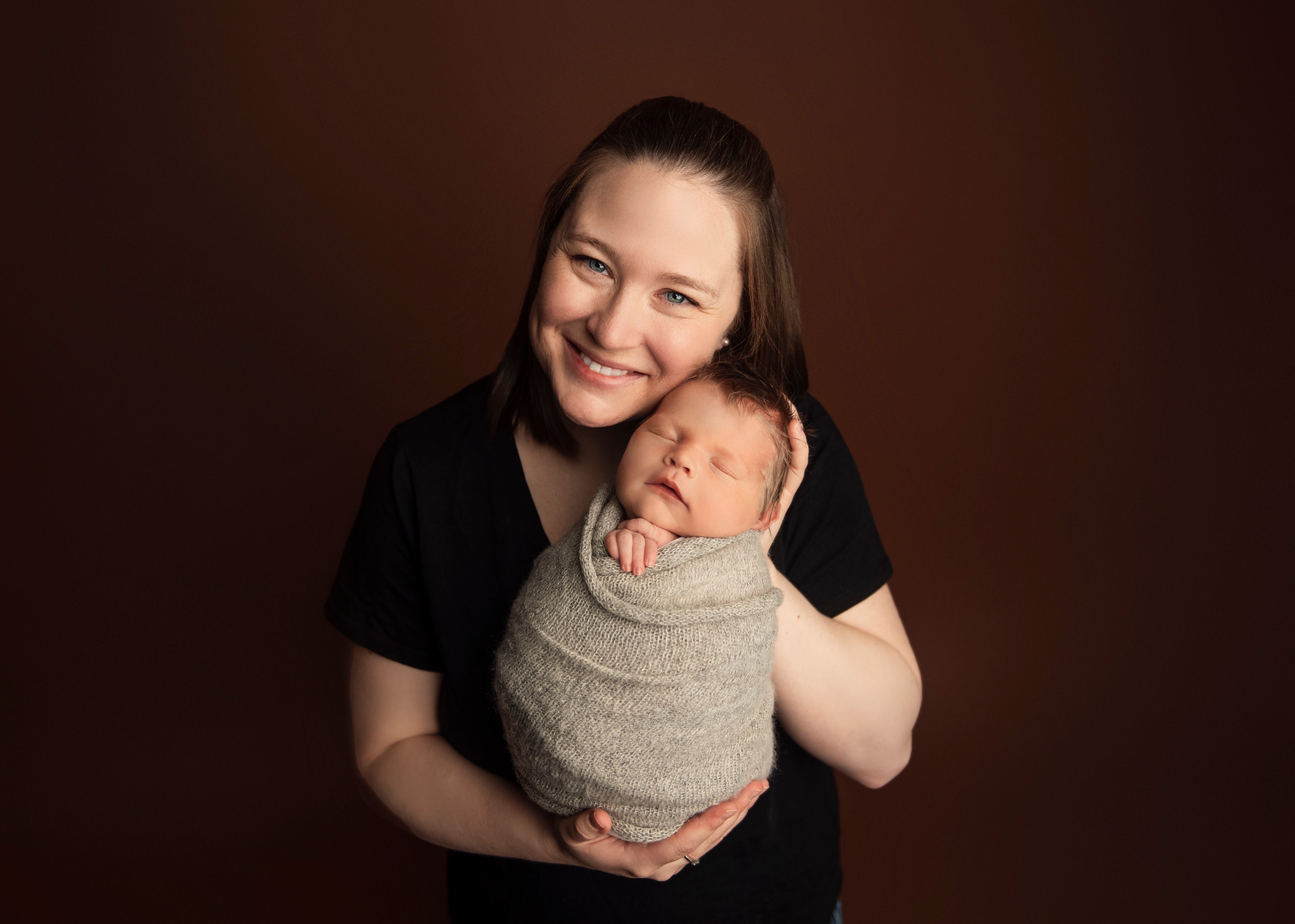 U.S. Air Force Maj. Jenna Waites poses with her child. While under official travel orders during her reassignment to the Command and General Staff College at Fort Leavenworth, Kansas, Waites was separated from her infant for a total of 10 days, reporting the cost of transporting a 14-day supply, 350 oz. or 45-lb shipment, of breast milk coming in at just under $500. (Photo courtesy of Rachel Kay)