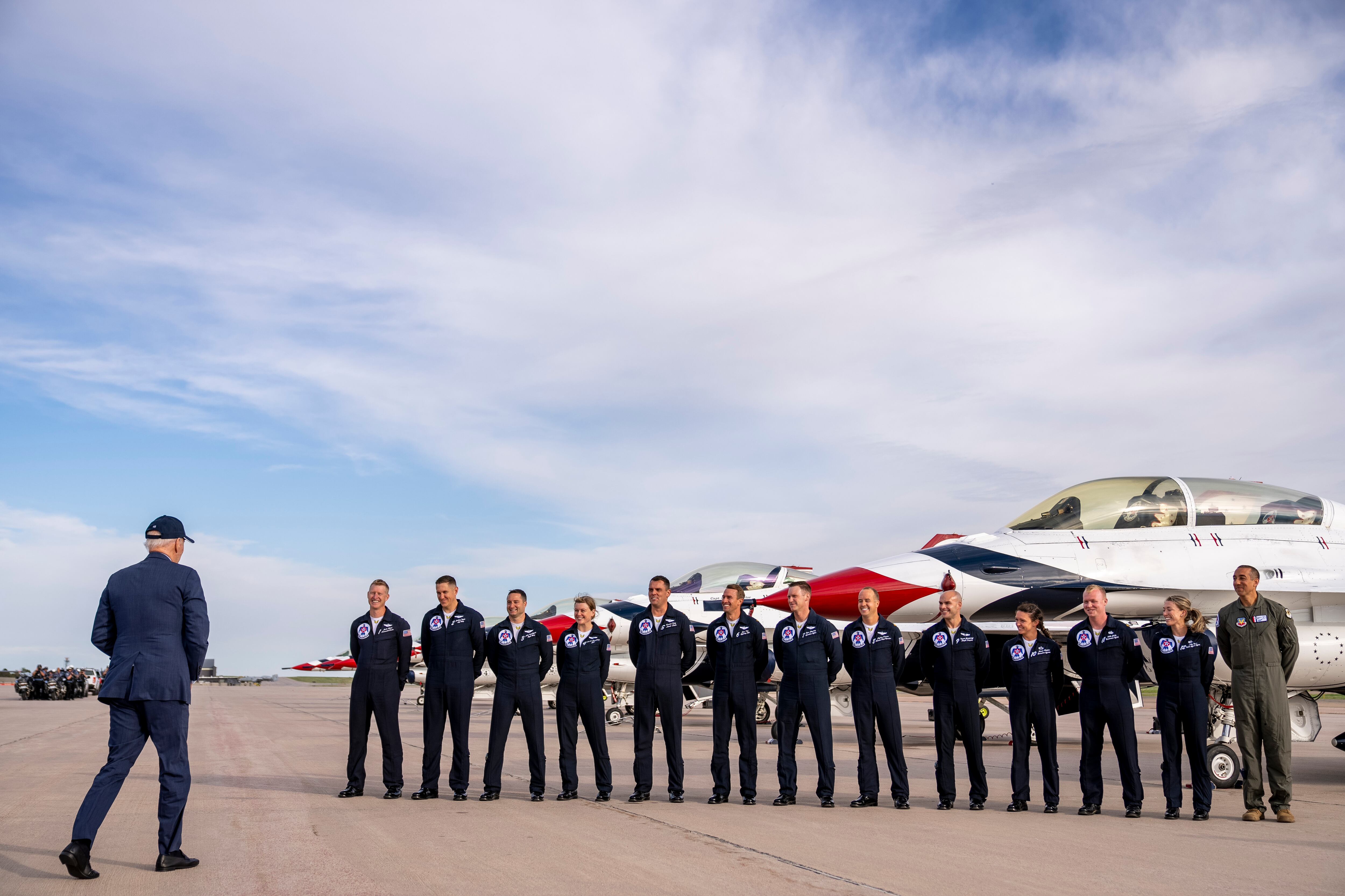 President Joe Biden greats a group of Thunderbird pilots after arriving at Peterson Space Force Base in Colorado Springs, Colo., Wednesday, May 31, 2023.