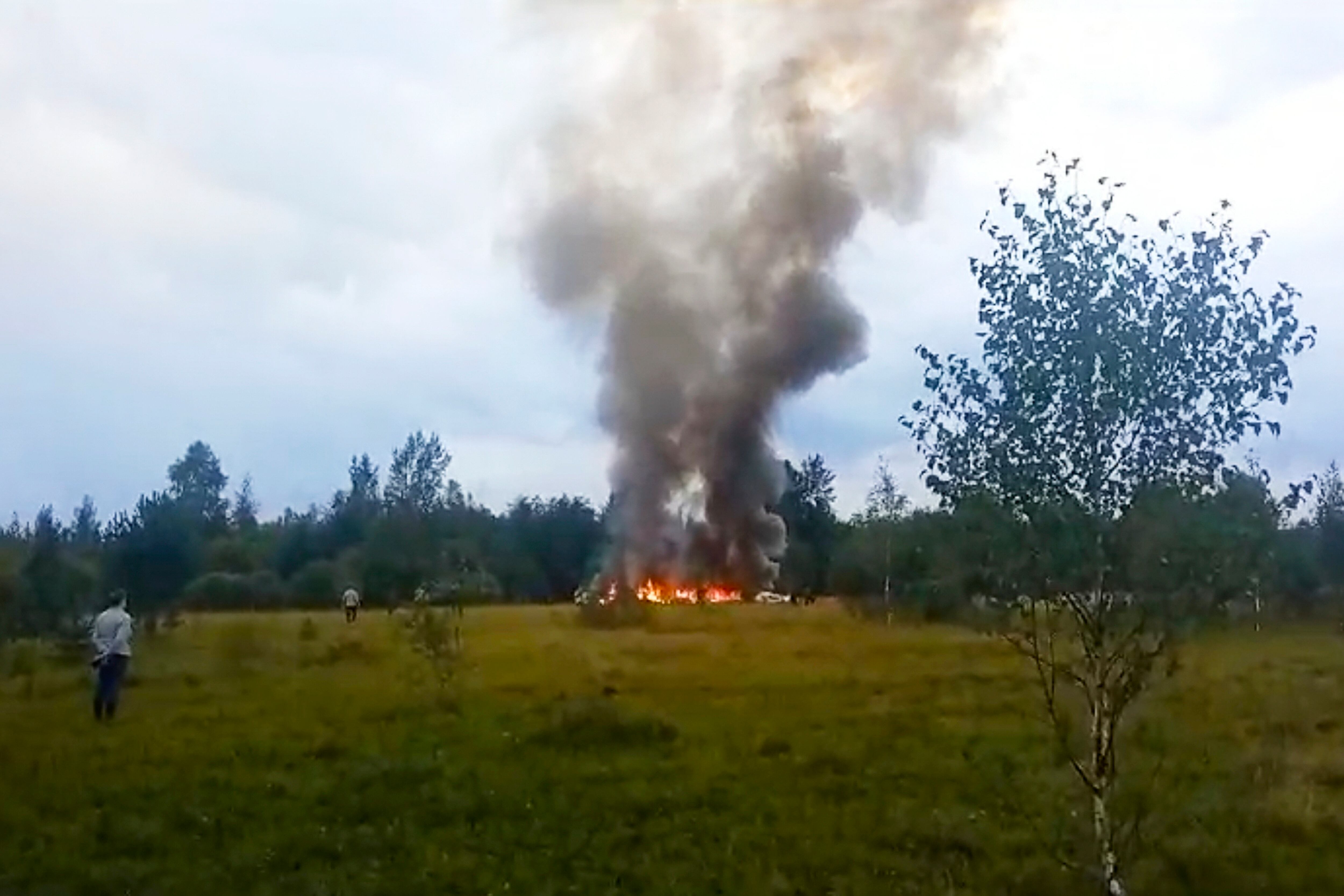 In this image taken from video, smoke rises from the crash of a private jet near the village of Kuzhenkino in the Tver region of Russia, on Wednesday, Aug. 23, 2023.