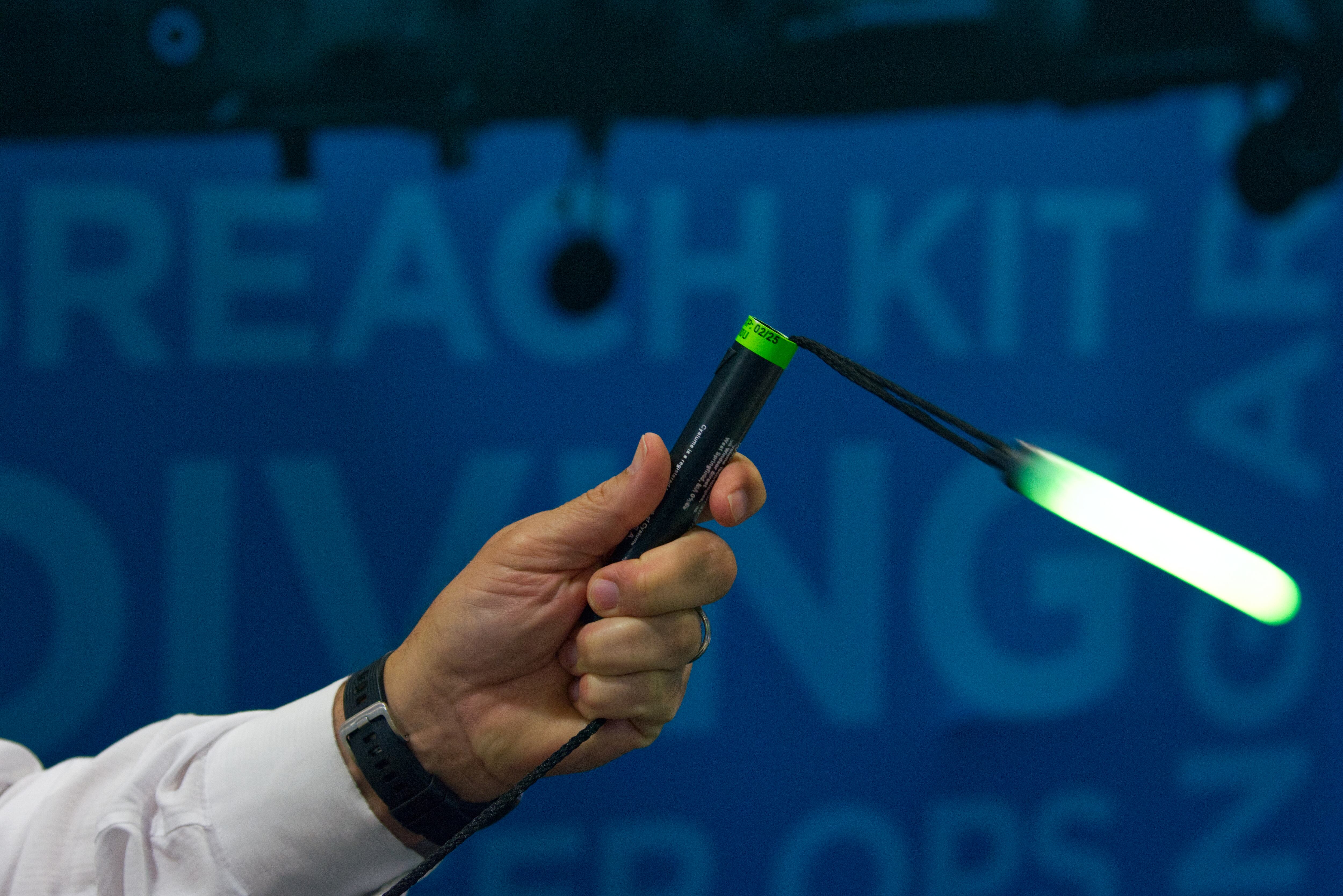 A man swings a Cyalume glow stick at the Association of the U.S. Army annual convention in Washington, D.C.