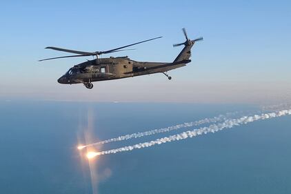 A UH-60 Black Hawk helicopter, operated by soldiers with Alpha Company, 2-104th General Support Aviation Battalion, 28th Expeditionary Combat Aviation Brigade, flies over the 28th ECAB's area of operations in the Middle East.