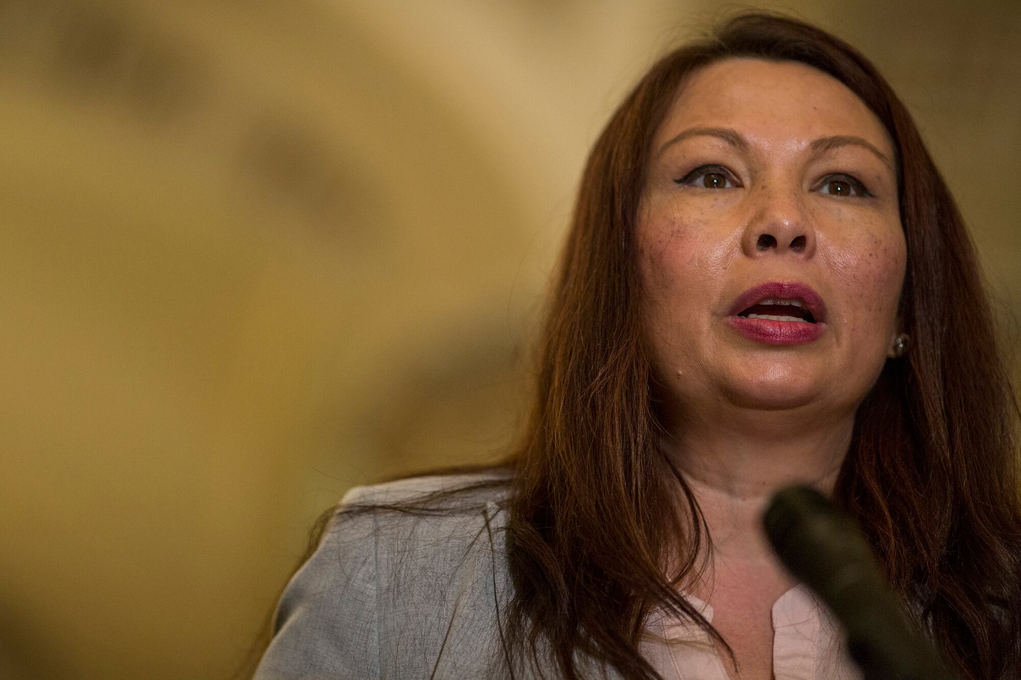 Sen. Tammy Duckworth, D-Ill., speaks during a weekly news conference on Capitol Hill  on Aug. 21, 2018, in Washington.