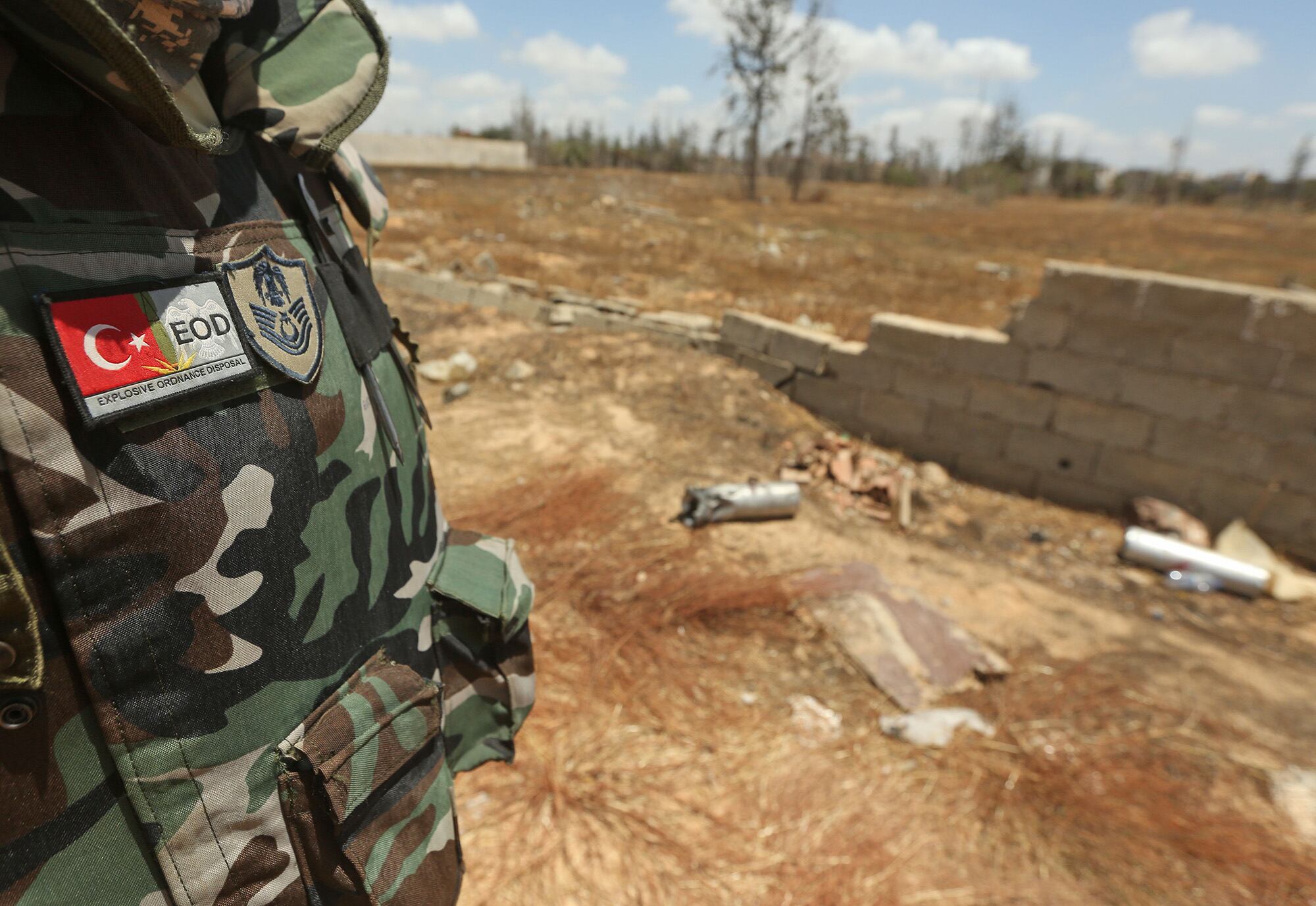 A Turkish deminer takes part in the clearance of unexploded ordnance remaining in the Salah al-Din area, south of the Libyan capital Tripoli, on June 15, 2020.