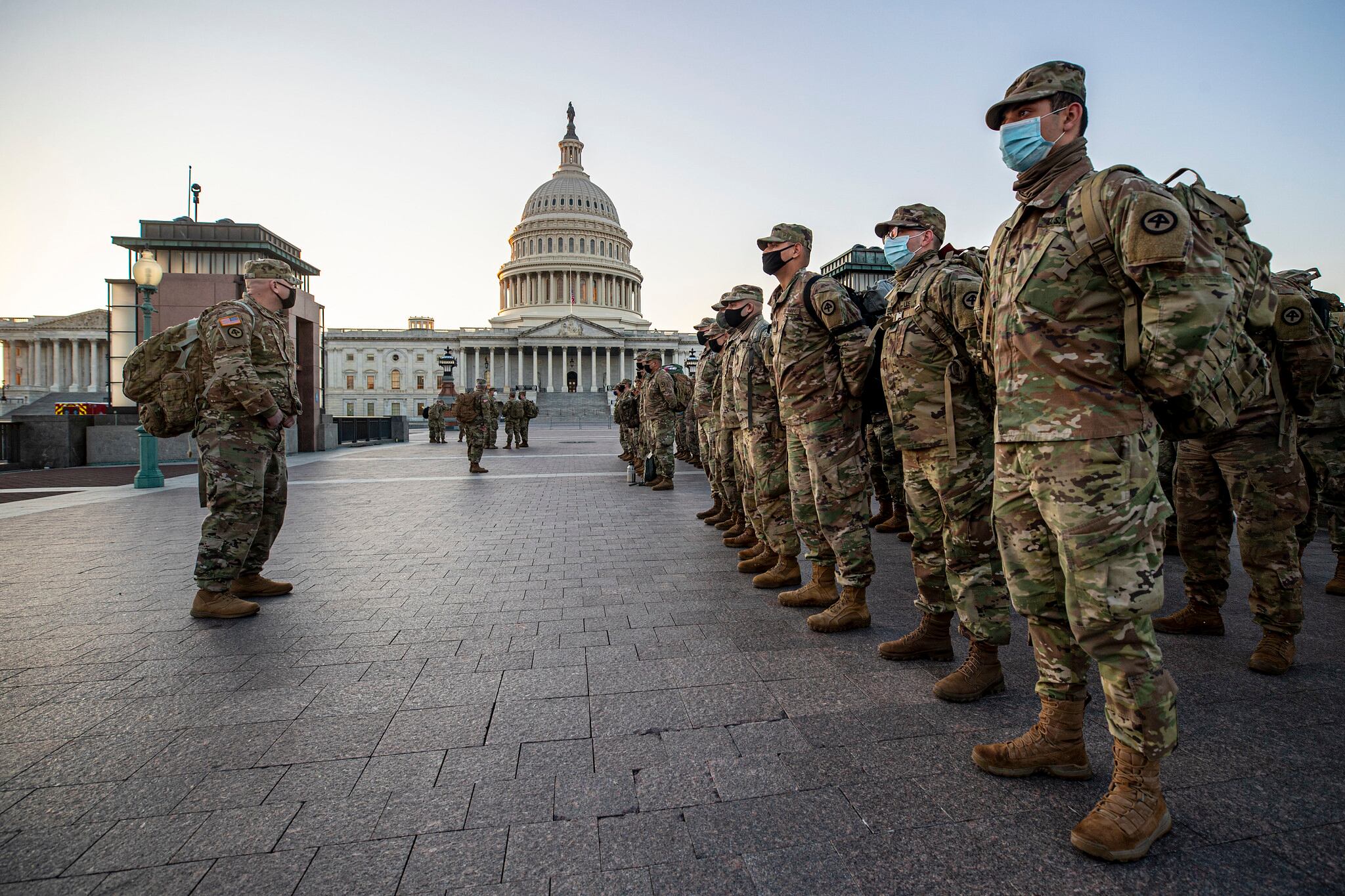 New Jersey National Guard soldiers and airmen from 1st Battalion, 114th Infantry Regiment, 508th Military Police Company, 108th Wing, and 177th Fighter Wing arrive near the Capitol to set up security positions in Washington on Jan. 12, 2021.