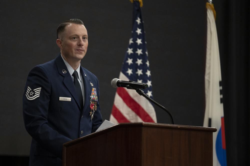 U.S. Air Force Tech. Sgt. Jordan Locke, 51st Security Forces Squadron flight sergeant, speaks during his Bronze Star award ceremony at Osan Air Base, Republic of Korea, Oct. 12, 2022. Locke thanked his family and fellow servicemen for their support and motivation that helped get him through his deployment. (Senior Airman Trevor Gordnier/Air Force)