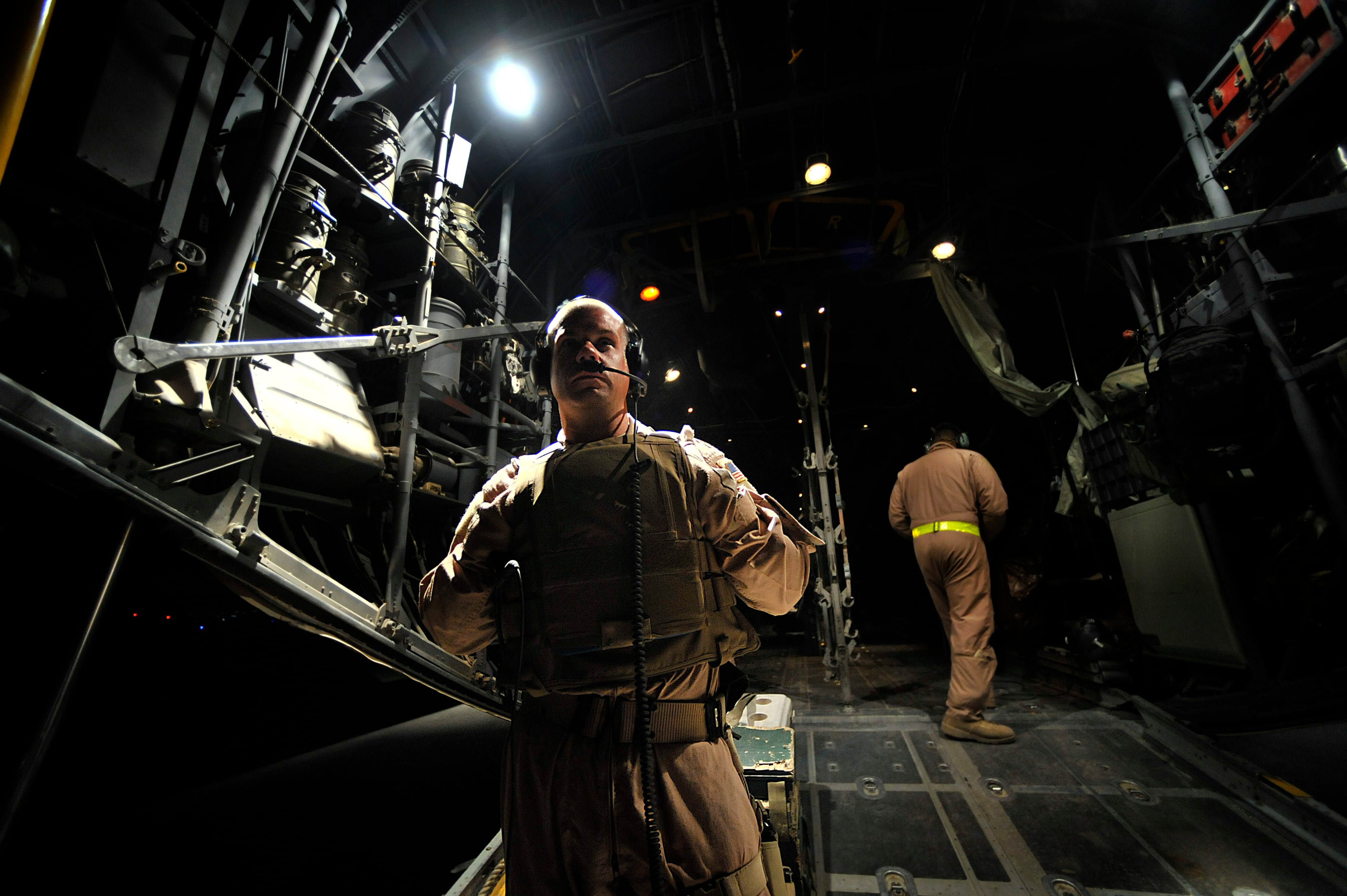 U.S. Air Force Maj. Brandon Bailey, 332nd Expeditionary Operations Support Squadron medical crew director, awaits the arrival of patients from a forward operating base in Mosul, Iraq, on Sept. 23, 2008, during a "Bandage Mission." Bandage Missions travel to different FOBs throughout Iraq and pick up patients and transport them to the Air Force Theater Hospital in Joint Base Balad, Iraq. (Staff Sgt. Aaron Allmon/Air Force)