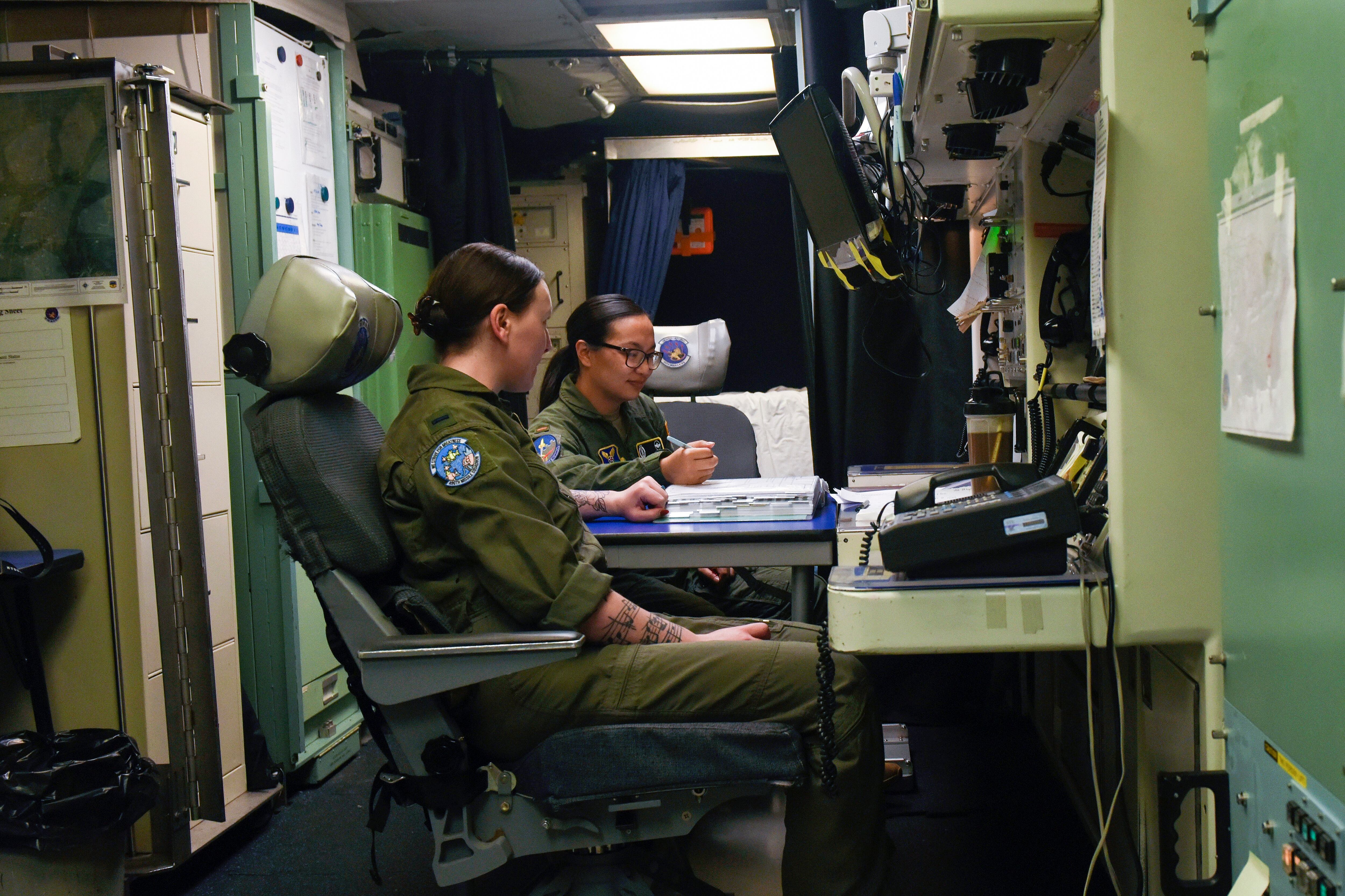 In this August 2023 photo provided by the U.S. Air Force, two missile launch officers, or missileers, finish a 24-hour underground shift at a launch control center at Malmstrom Air Force Base.