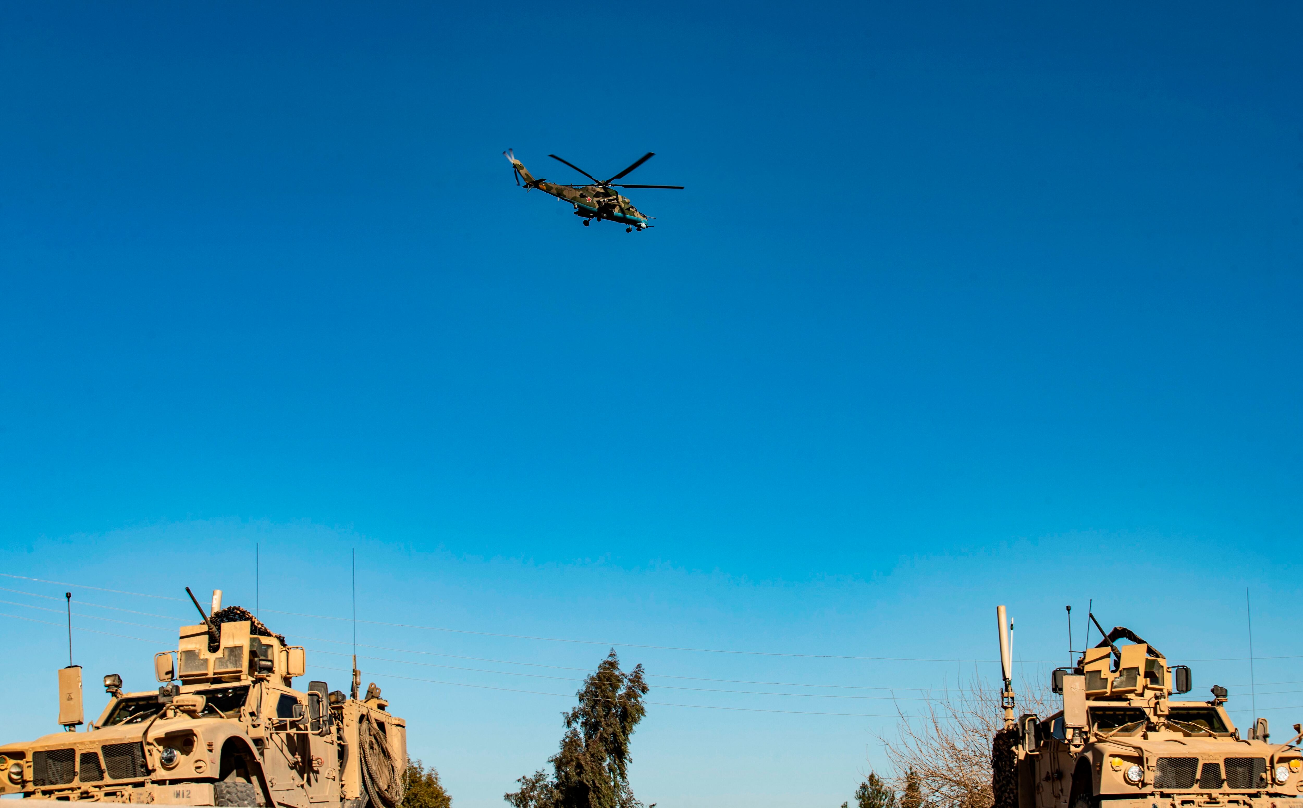 Russian army helicopter, US vehicles, Syria