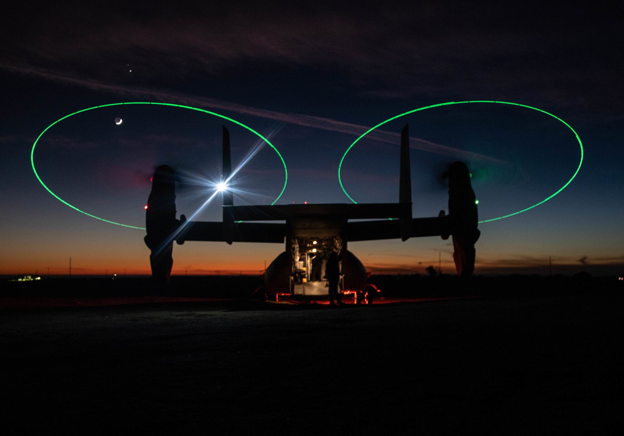 An MV-22 Osprey stages during a night during a Tactical Recovery of Aircraft and Personnel (TRAP) exercise at Marine Corps Base Camp Pendleton, Calif., Dec. 16, 2020.