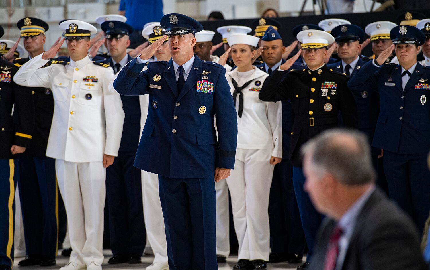 U.S. Space Command Chief of Staff, Brig. Gen. Brook Leonard, and the rest of his staff give their first salute to Commander Gen. John W. Raymond