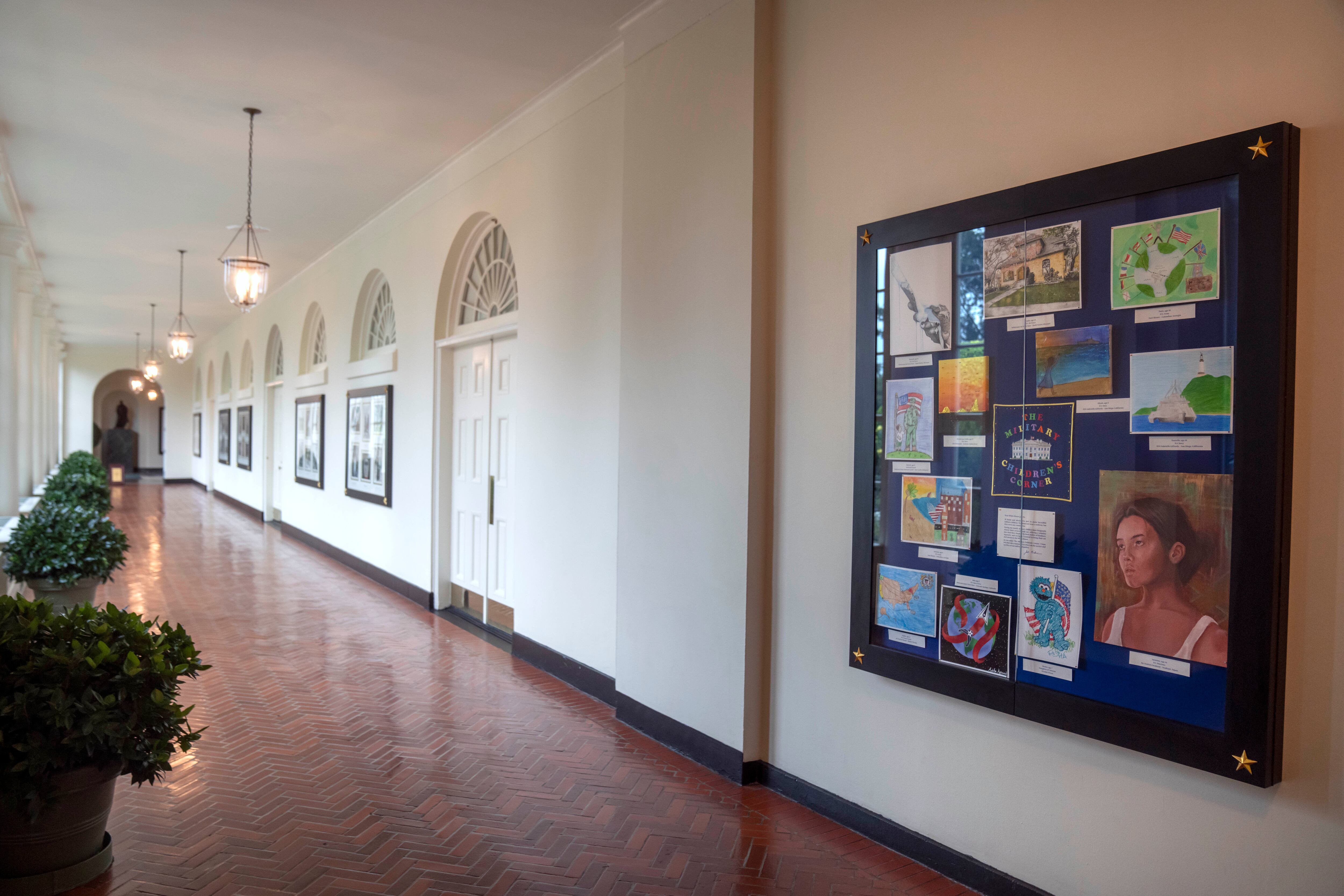 Artwork by military children decorates a display in the East Colonnade of the East Wing at the White House, Tuesday, Sept. 26, 2023, in Washington.