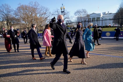 President Joe Biden and first lady Jill Biden walk up Pennsylvania Avenue towards the White House in Washington after Biden and Kamala Harris were sworn in at the Capitol on Jan. 20, 202.